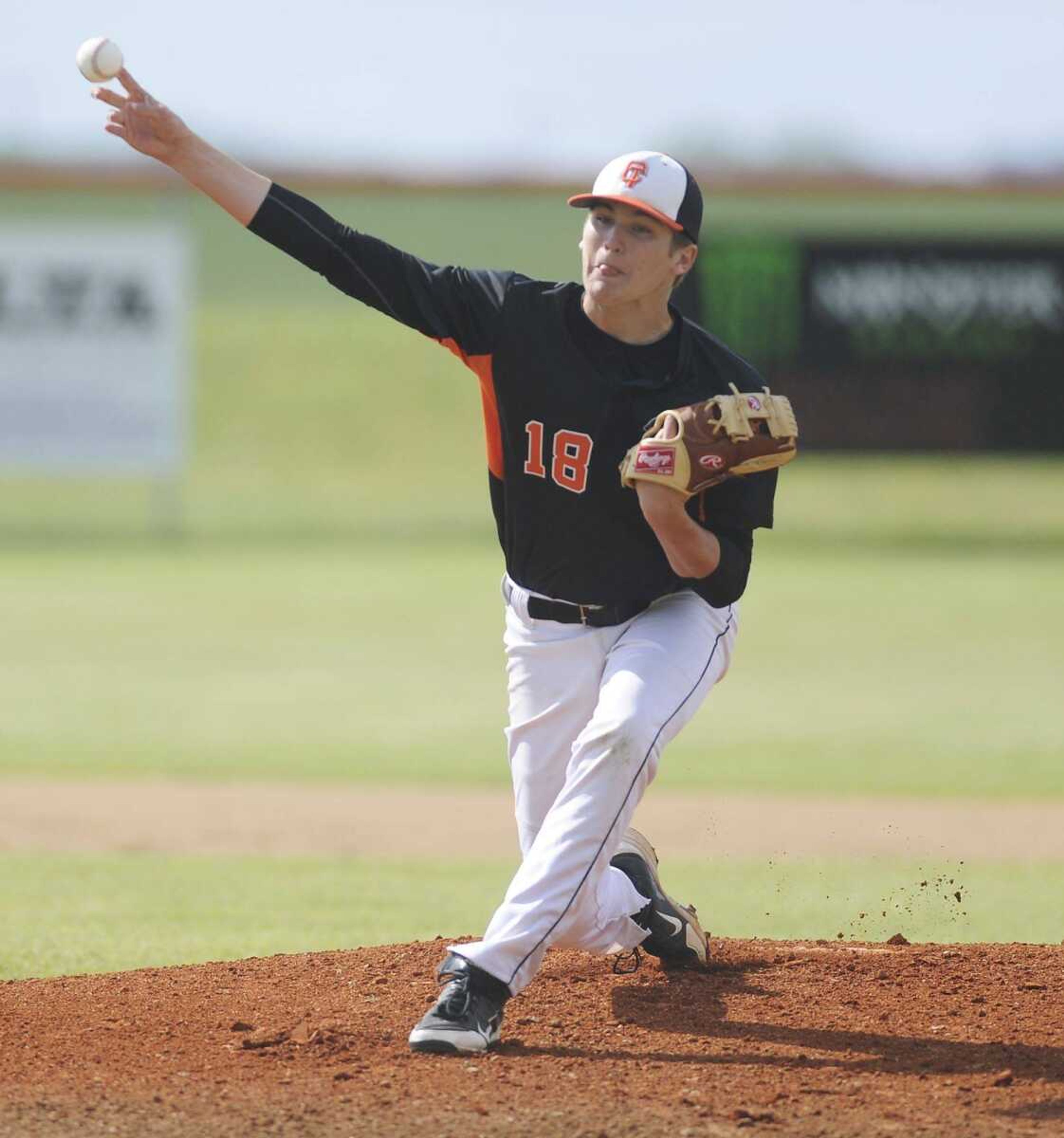 Central&#8217;s Chase Hagerty delivers a pitch to a Dexter batter Monday at Central High School. Dexter won 6-2. (ADAM VOGLER)