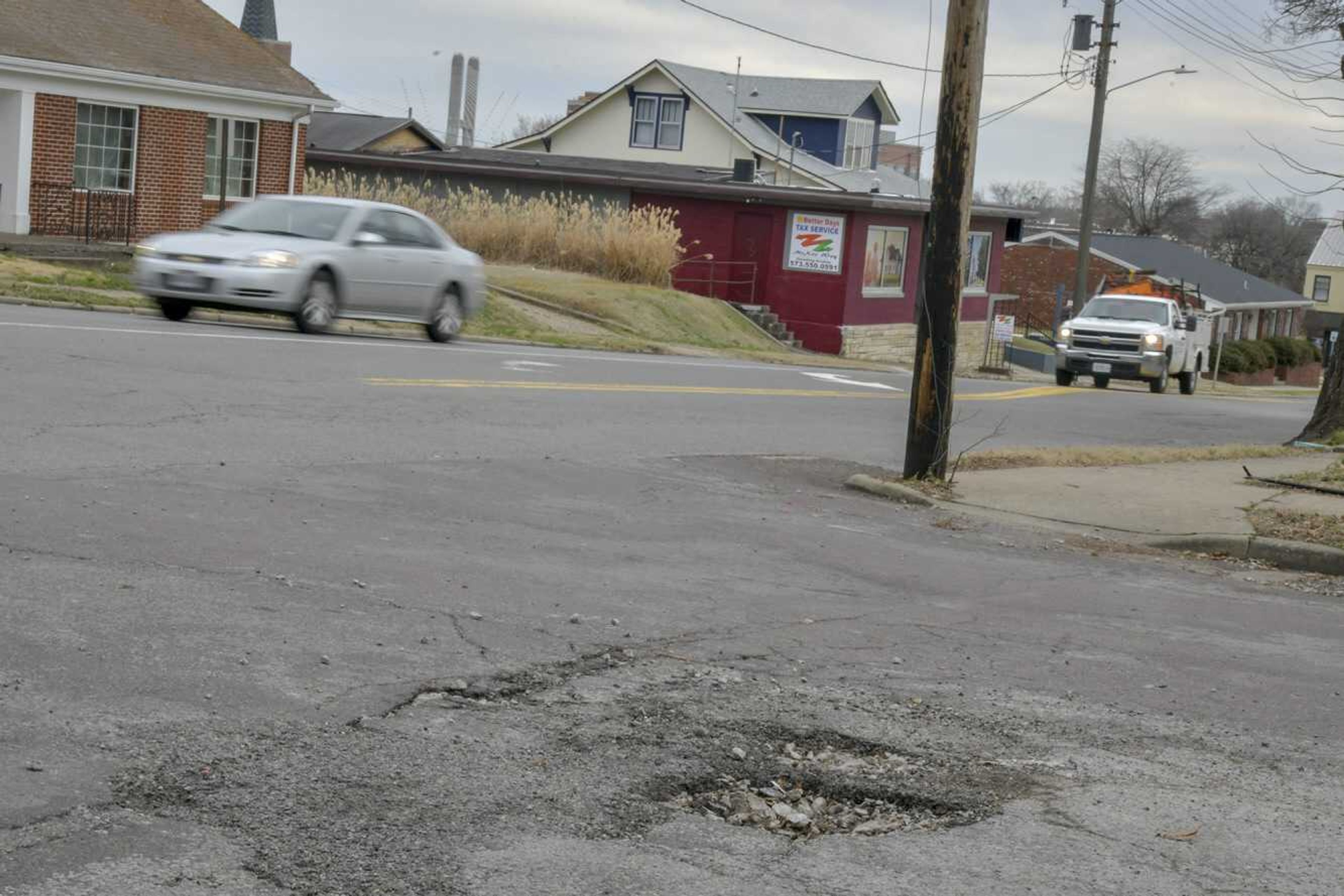 A pot hole is seen Monday at the intersection of North Sprigg and Bellevue streets in Cape Girardeau.