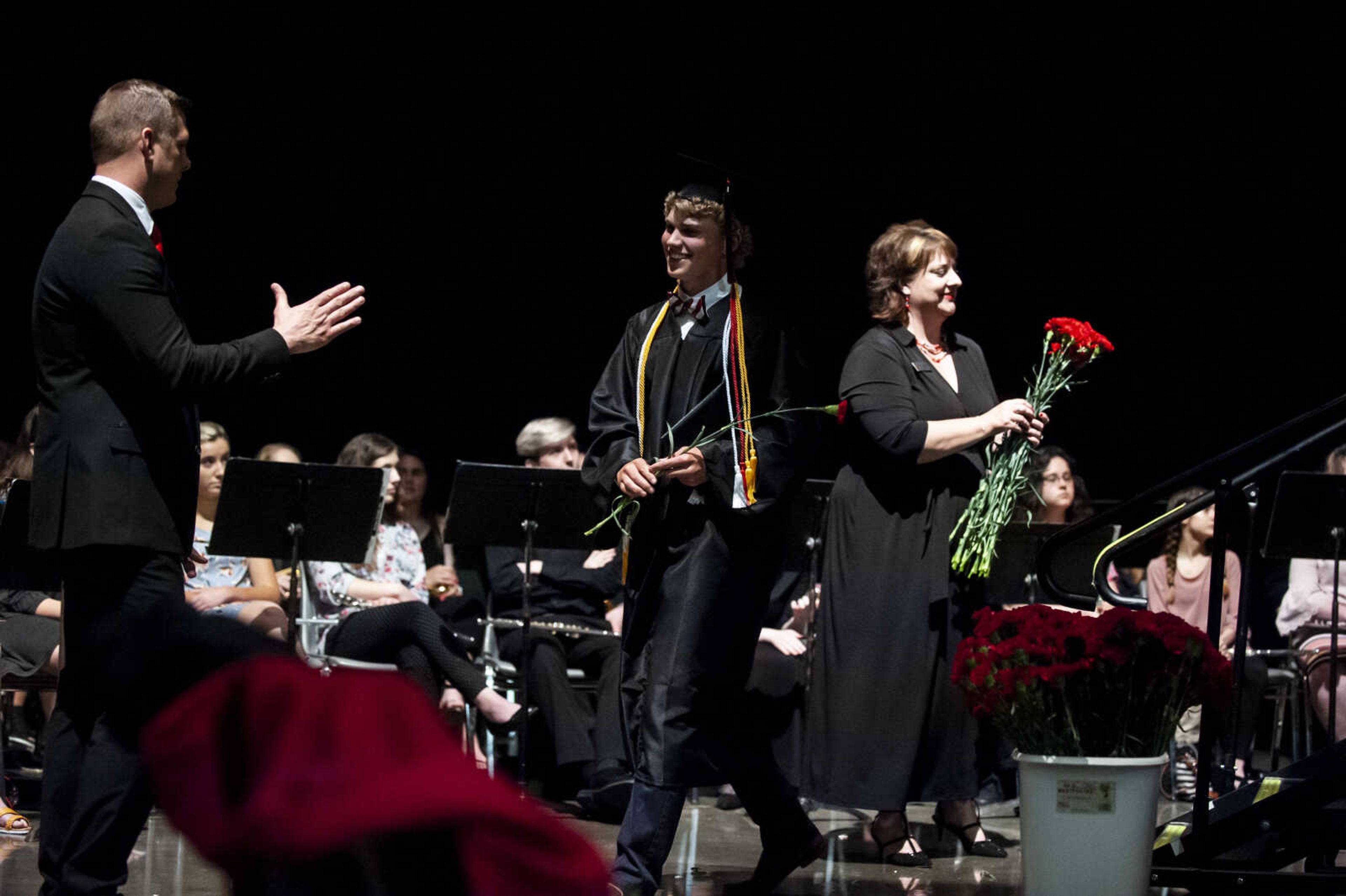 Case Englehart is congratulated after walking across the stage and receiving his diploma during the Jackson High School Class of 2019 Commencement at the Show Me Center Friday, May 24, 2019, in Cape Girardeau.