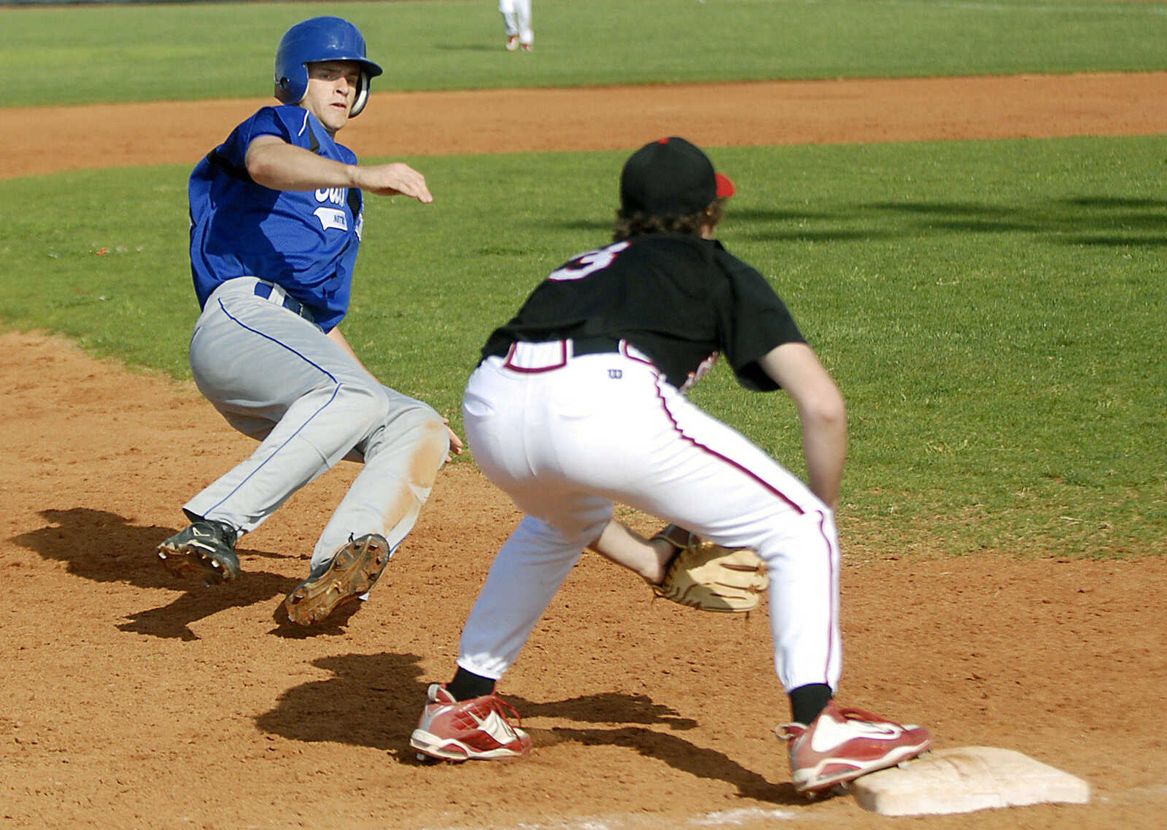 Notre Dame senior Austin Greer safely advances to third base Tuesday, April 28, 2009, against Sikeston in Cape Girardeau.