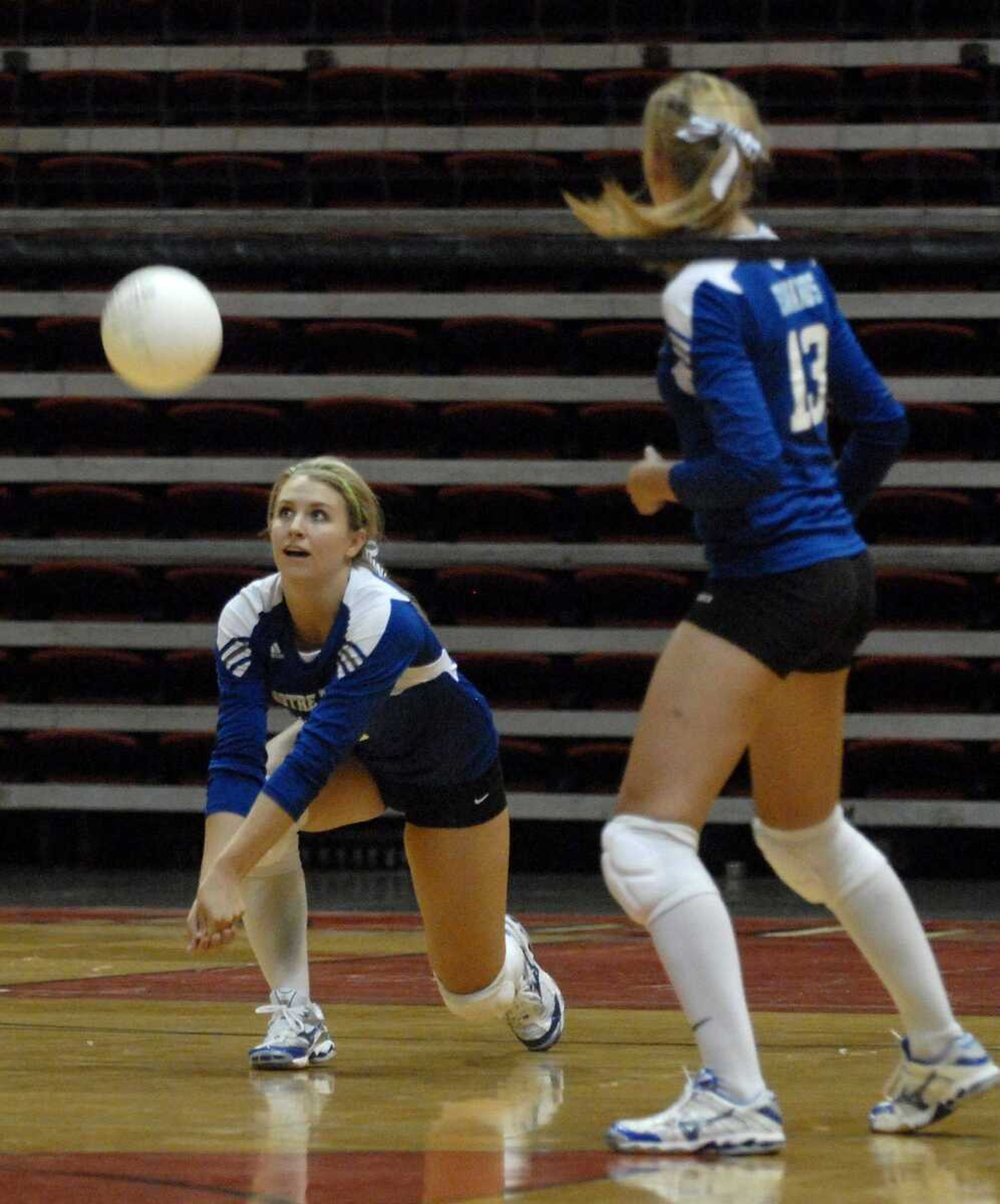 Notre Dame's Allyson Bradshaw passes the ball as teammate Kate Edwards looks on during the second game of Saturday's title match t the SEMO Spike tournament.