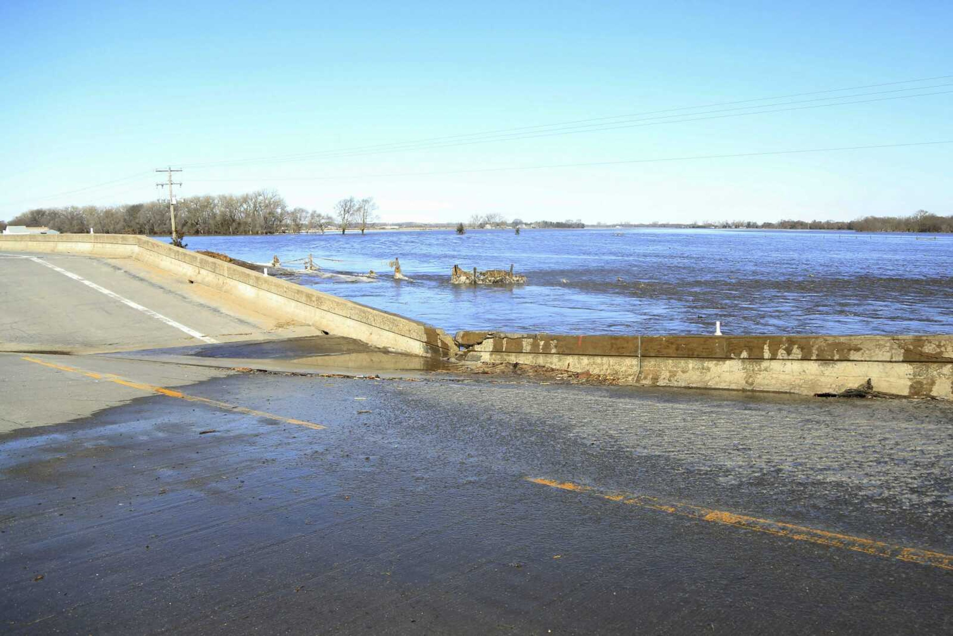 A bridge brought down by flood waters is seen March 15 near Norfolk, Nebraska.