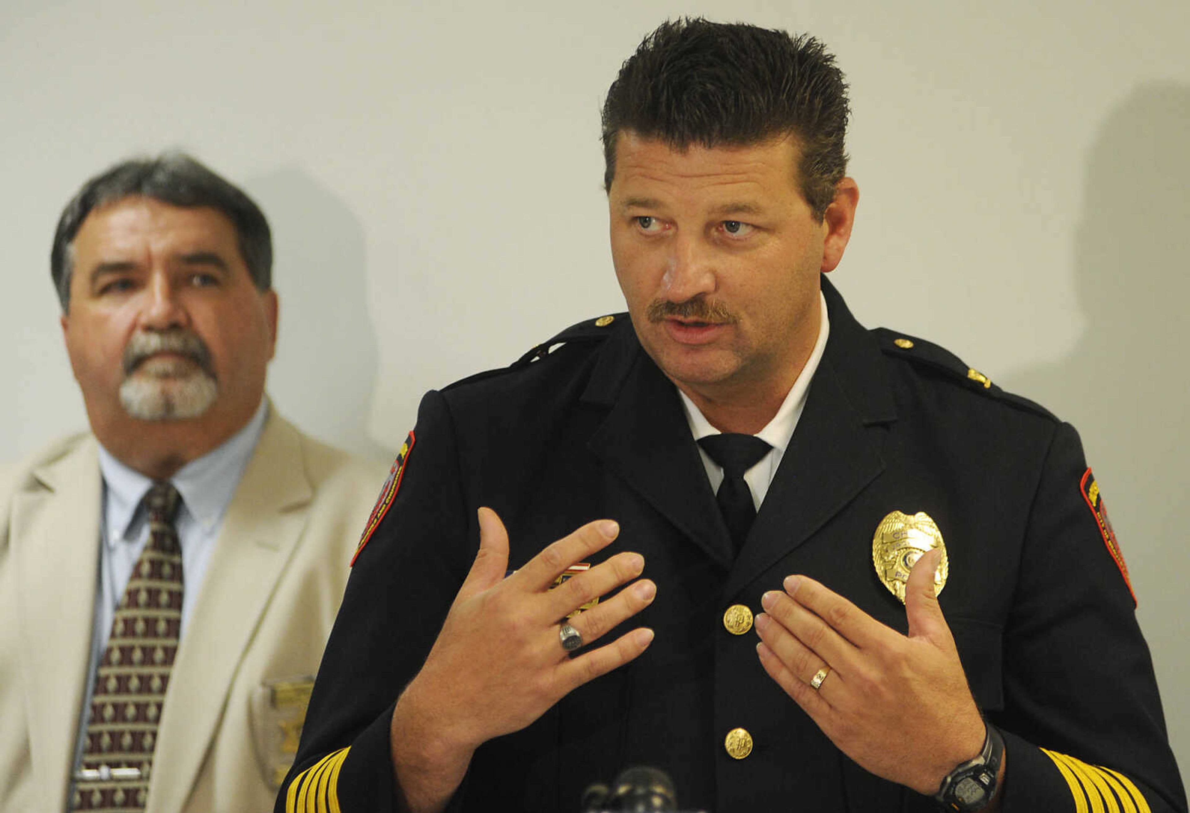 Cape Girardeau County Sheriff John Jordan watches, left, as Jackson Police chief James Humphreys speaks during a news conference Thursday, June 6, 2013, at the Cape Girardeau County Sheriff's Office after a hearing at the Cape Girardeau County Courthouse where Clay Waller pleaded guilty to killing his wife, Jacque Waller, on June 1, 2011.