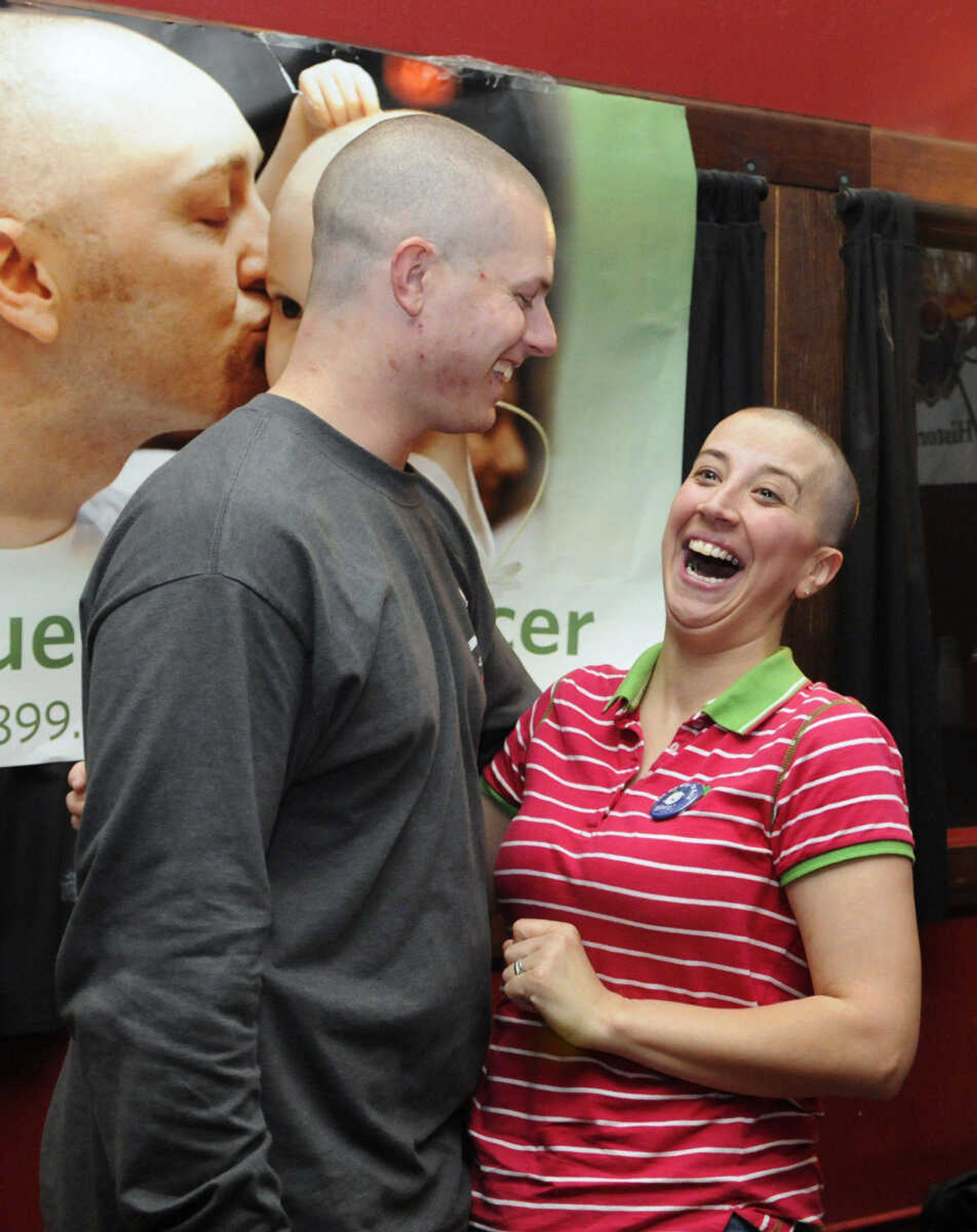 KRISTIN EBERTS ~ keberts@semissourian.com

Damon and Robin Shy both shaved their heads during the St. Baldrick's event at Buckner Brewing Company in Cape Girardeau, Mo., on Saturday, April 24, 2010. Robin was the only female to shave her head, and did so after reaching her goal of raising $500.