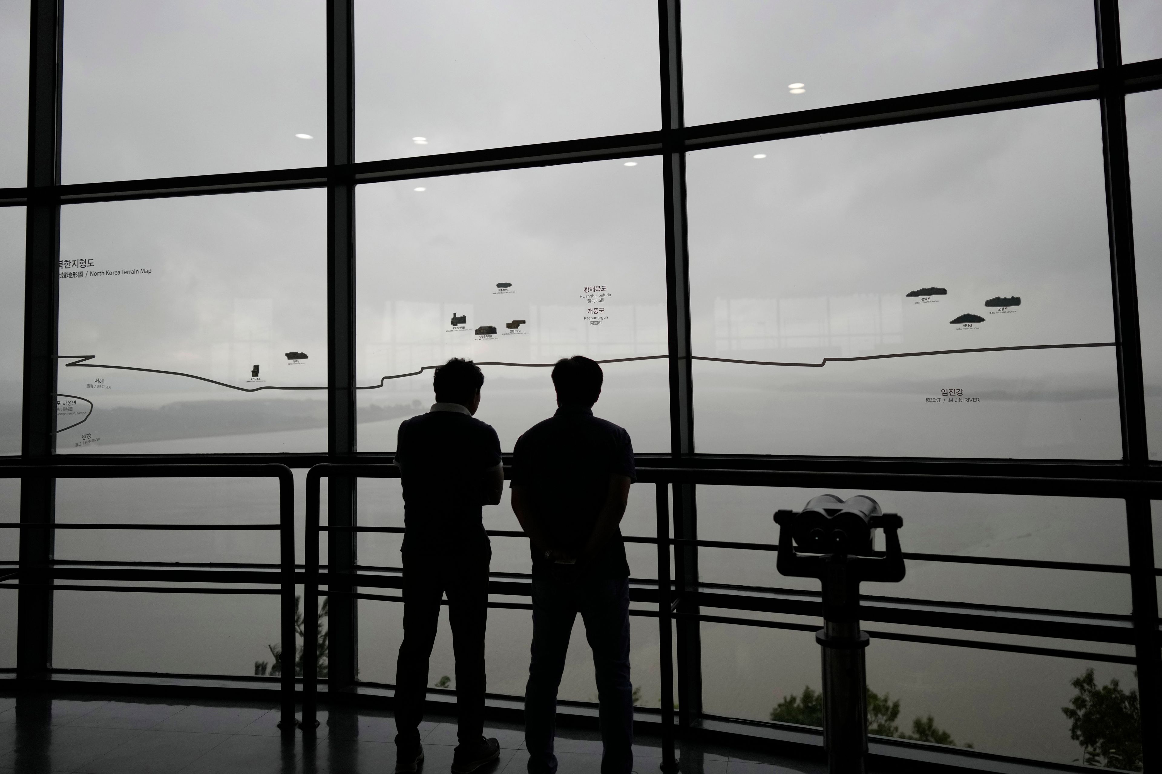 Visitors look at the North Korean side from the unification observatory in Paju, South Korea, Thursday, Sept. 5, 2024. (AP Photo/Lee Jin-man)