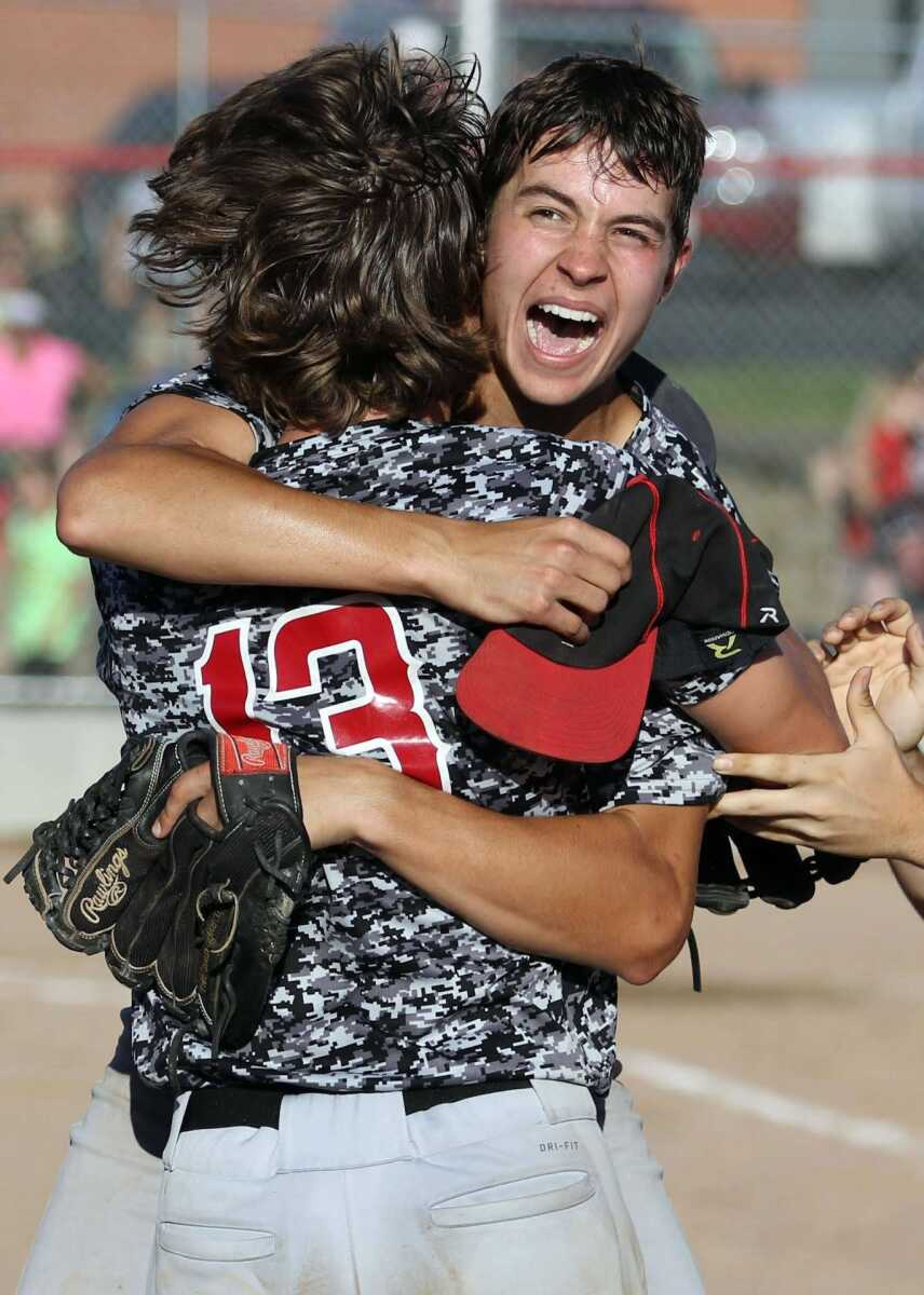 Bell City's Cole Nichols hugs teammate Austin Hicks after the Cubs booked their second straight trip to the Class 1 final four with a 3-0, nine-inning win over Bismarck on Wednesday in Bismarck, Missouri.