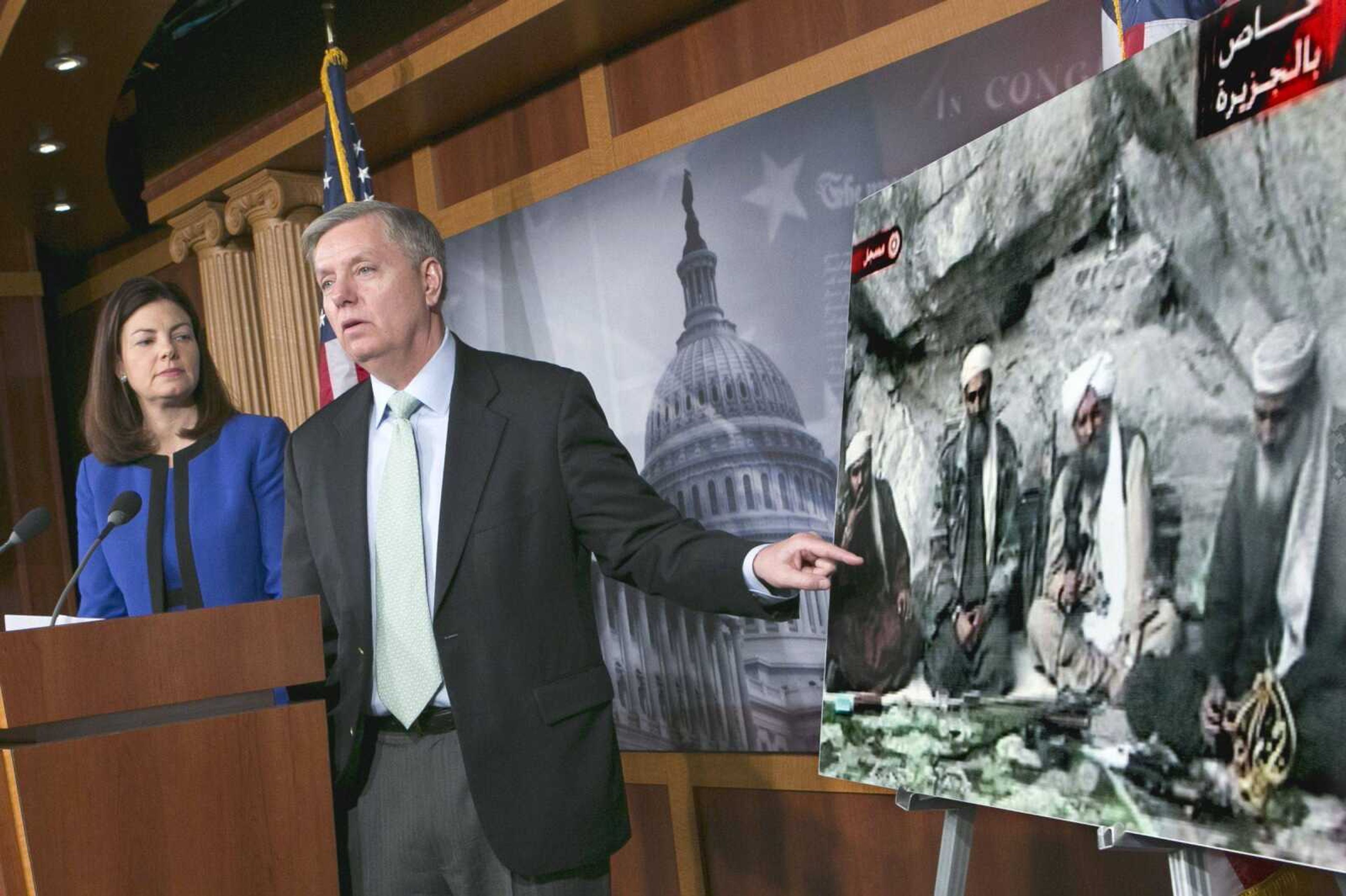 Sen. Lindsey Graham, R-S.C., right, accompanied by Sen. Kelly Ayotte, R-N.H., speaks to reporters Thursday on Capitol Hill about the capture of Osama bin Laden&#8217;s son-in-law Sulaiman Abu Ghaith. (J. Scott Applewhite ~ Associated Press)