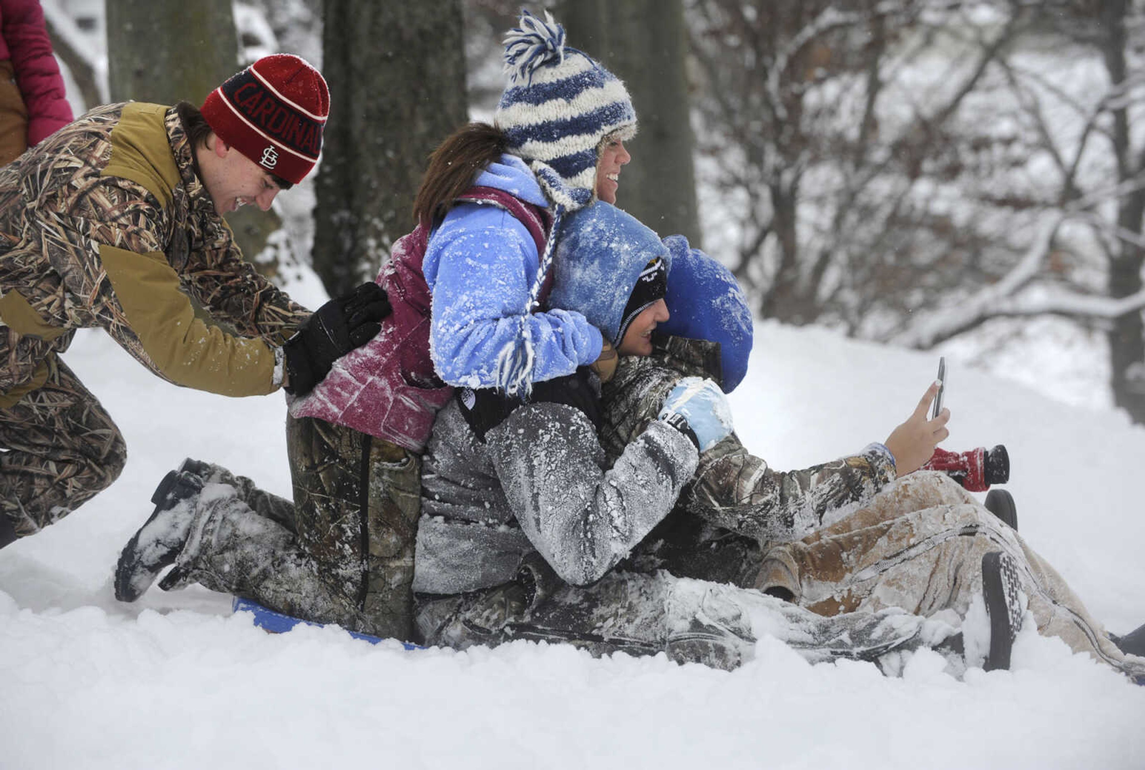 LAURA SIMON ~ lsimon@semissourian.com

People sled down the hillside outside the Common Pleas Courthouse, Monday, Feb. 16, 2015, in Cape Girardeau.