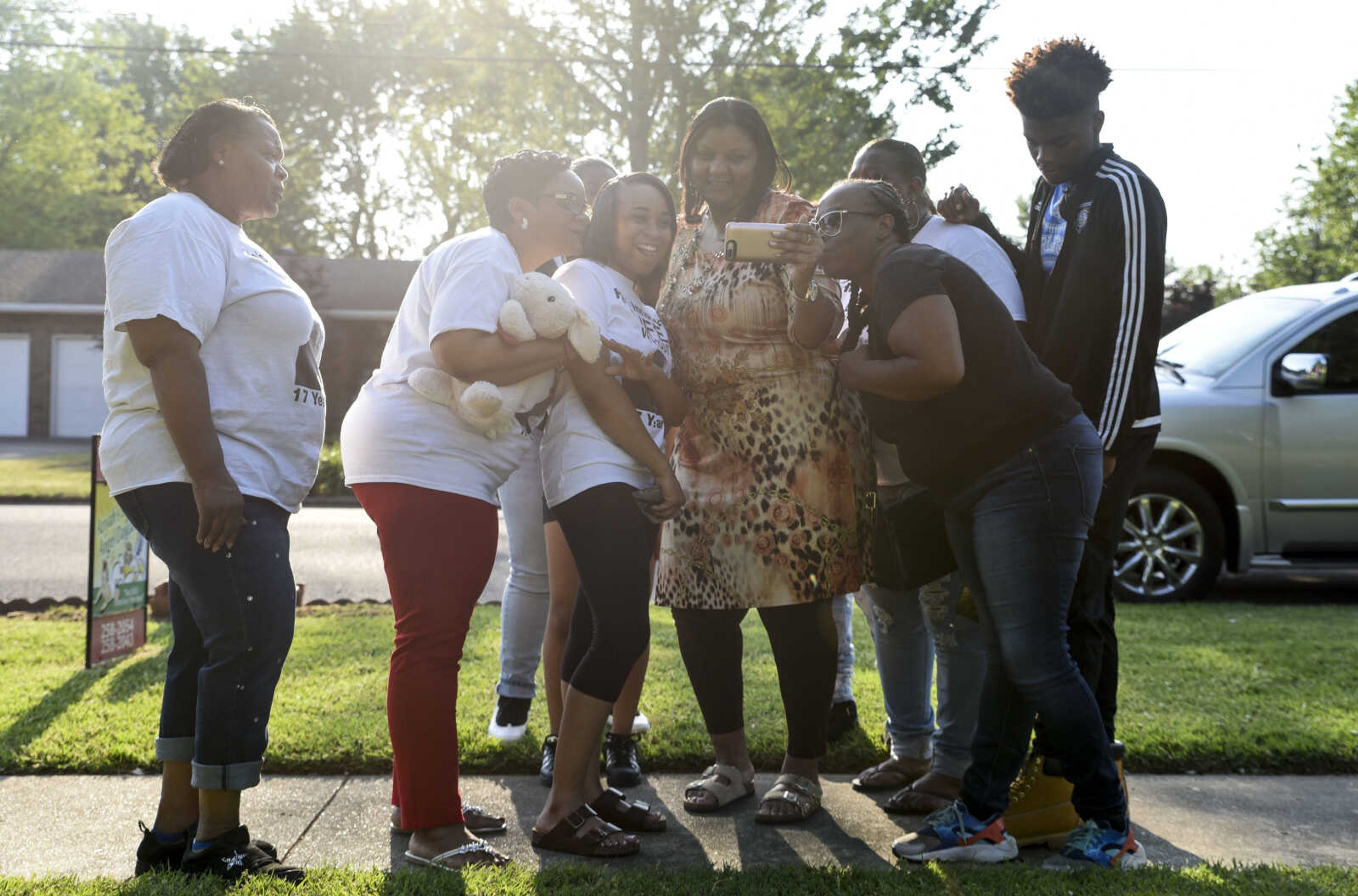 David Robinson's family watch a CBS special on the David Robinson case in the front yard of Betty Sharp's Sikeston home before departing for the Jefferson City Correctional Center Monday, May 14, 2018.