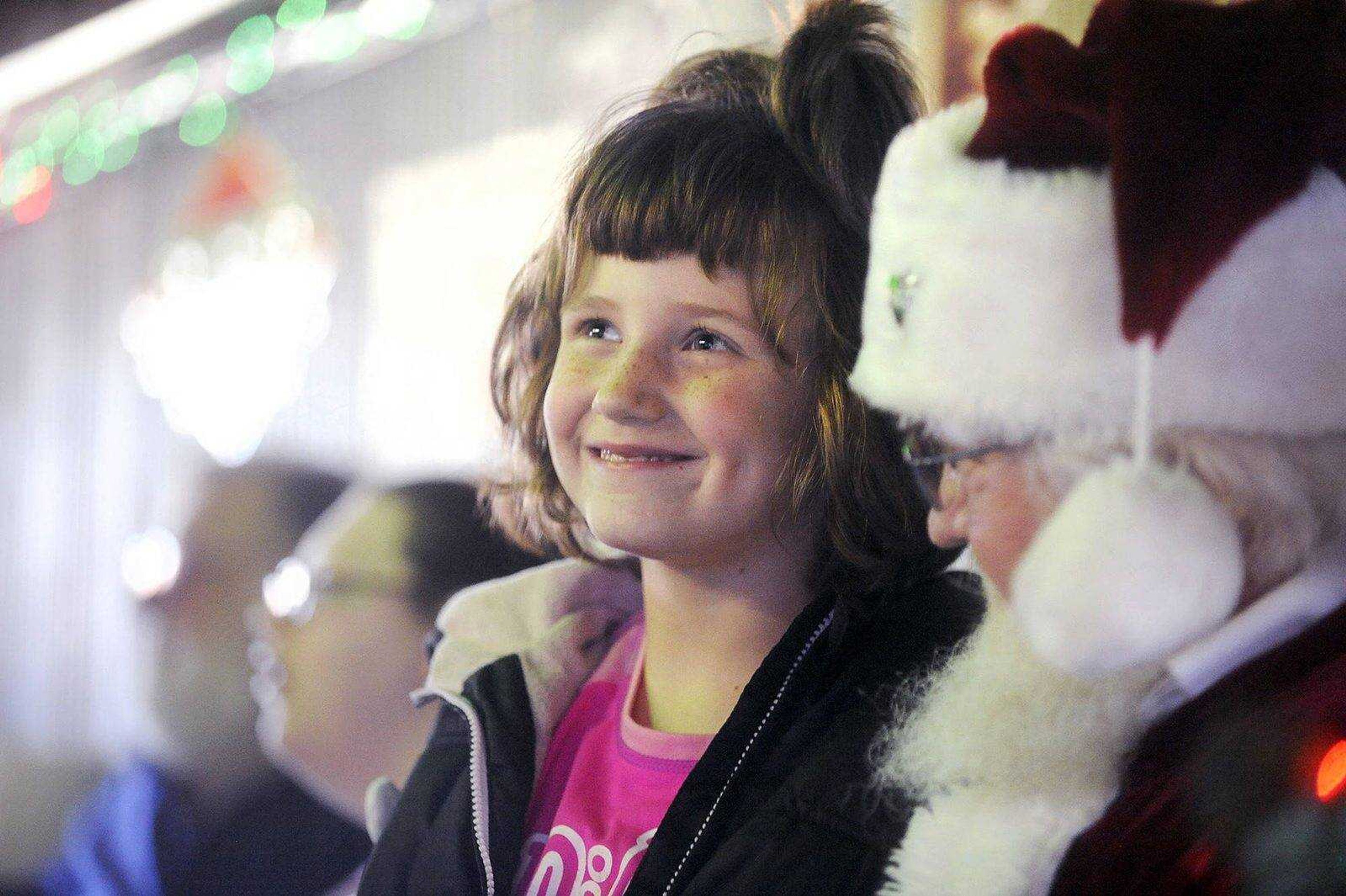 Audrionna Northern visits with Santa Claus during Christmas lunch at Stooges restaurant in Jackson, Dec. 25, 2015.