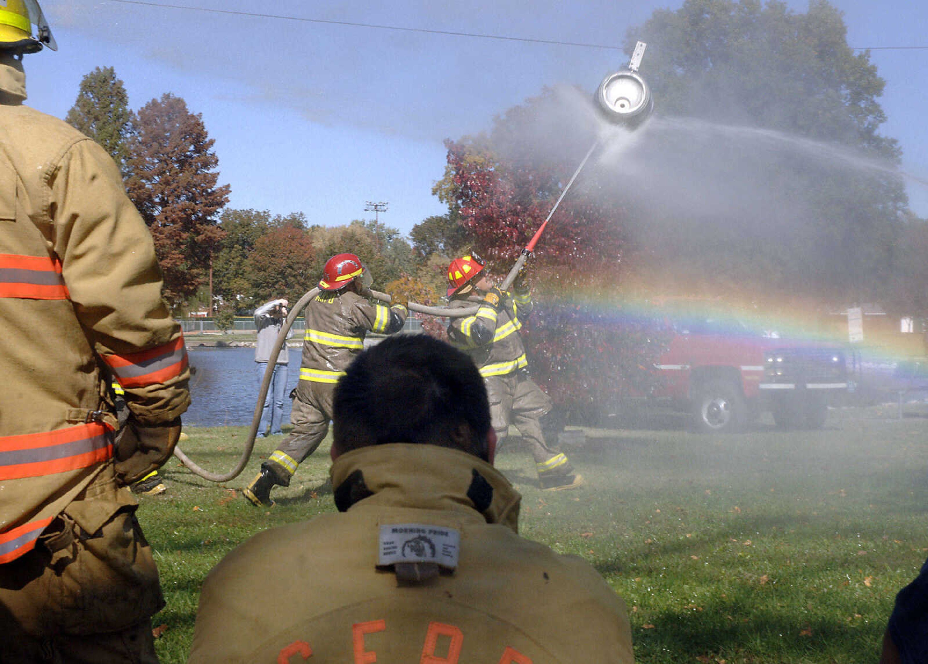 LAURA SIMON~photos@semissourian.com
Members of the Gordonville Fire department watched as the Millersville Fire Department competed in the keg race Saturday during the 6th annual Capaha Fire Truck Rally. There were more than seven fire departments involved in the rally, with four of them competing in the day's numerous competitions. The turn out was up at the rally from last year with approximately 2000 people attending.