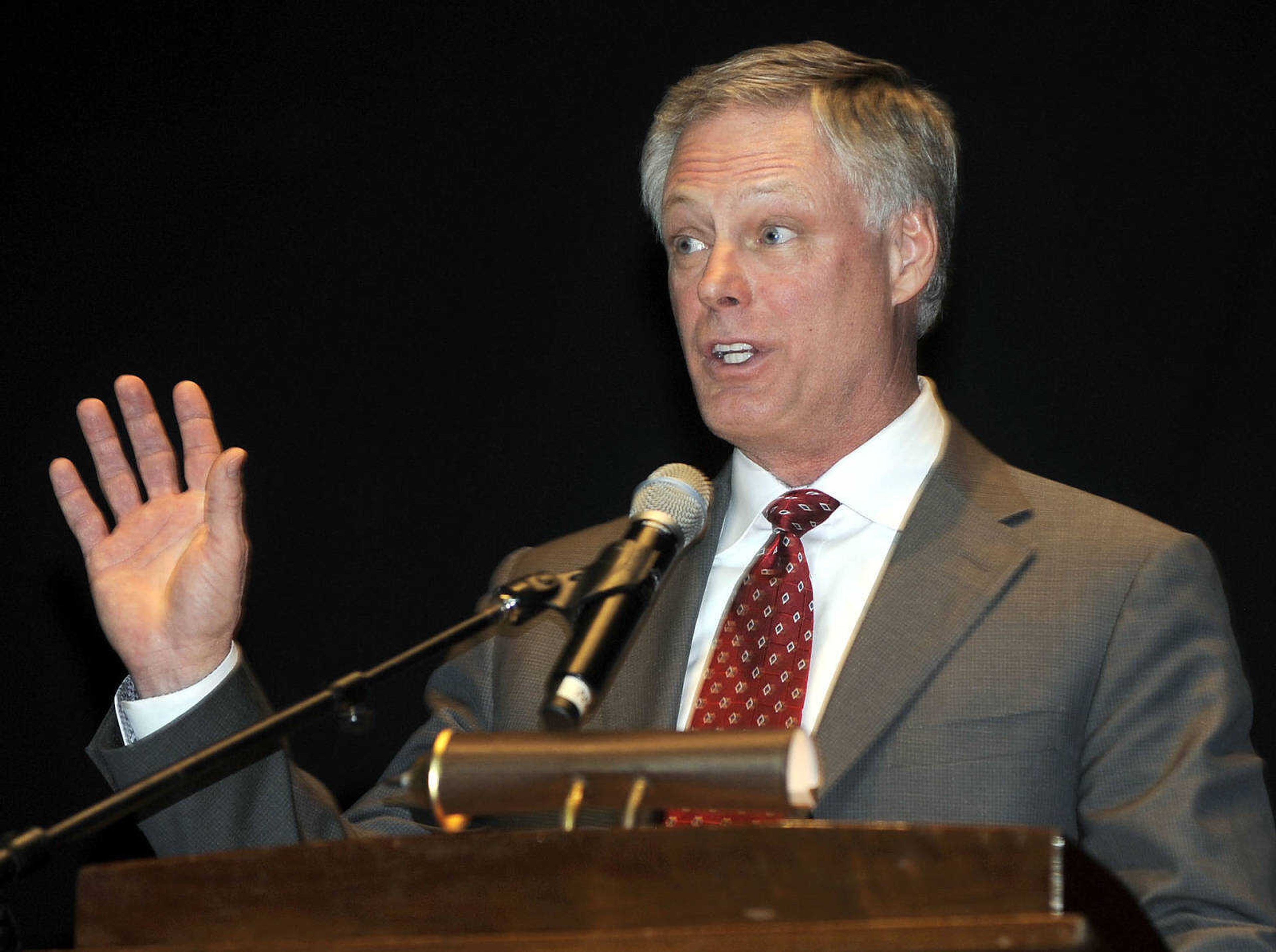 Tim Drury speaks on behalf of his father, Charles L. Drury, who was presented with the Rush H. Limbaugh Award of the Cape Girardeau Area Chamber of Commerce at its annual dinner Friday at the Show Me Center.