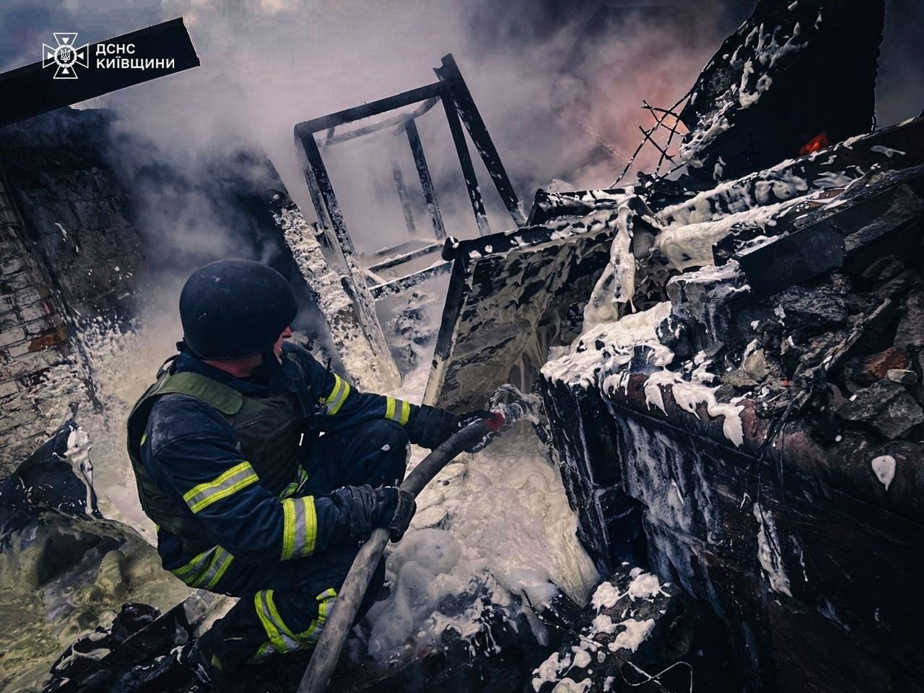 In this photo provided by the Ukrainian Emergency Service on Nov. 13, 2024, rescue workers extinguish a fire of a building destroyed by a Russian strike in Brovary, outside Kyiv, Ukraine. (Ukrainian Emergency Service via AP)