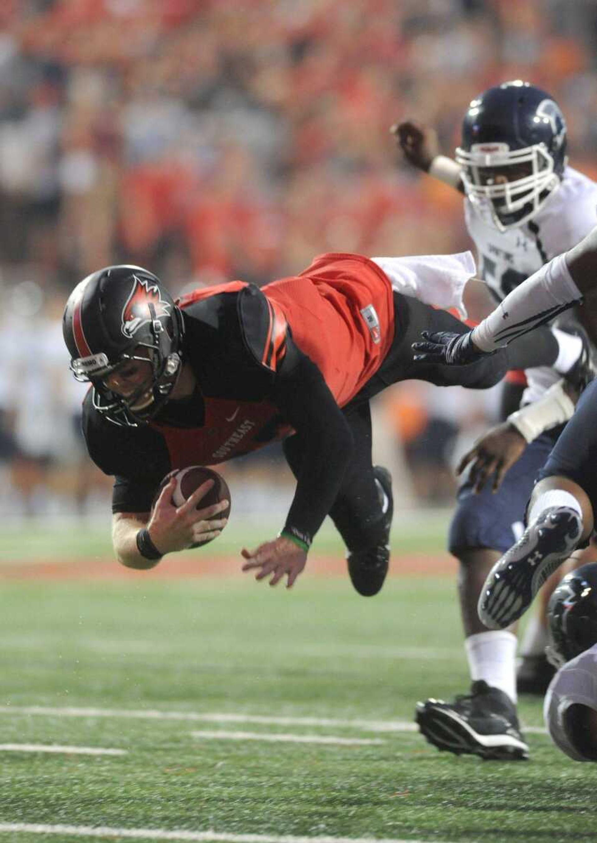 Southeast Missouri State's Kyle Snyder leaps and land just shy of a touchdown during the seasons first game against Missouri Baptist Thursday, Aug. 28, 2014 at Houck Stadium. (GLENN LANDBERG)