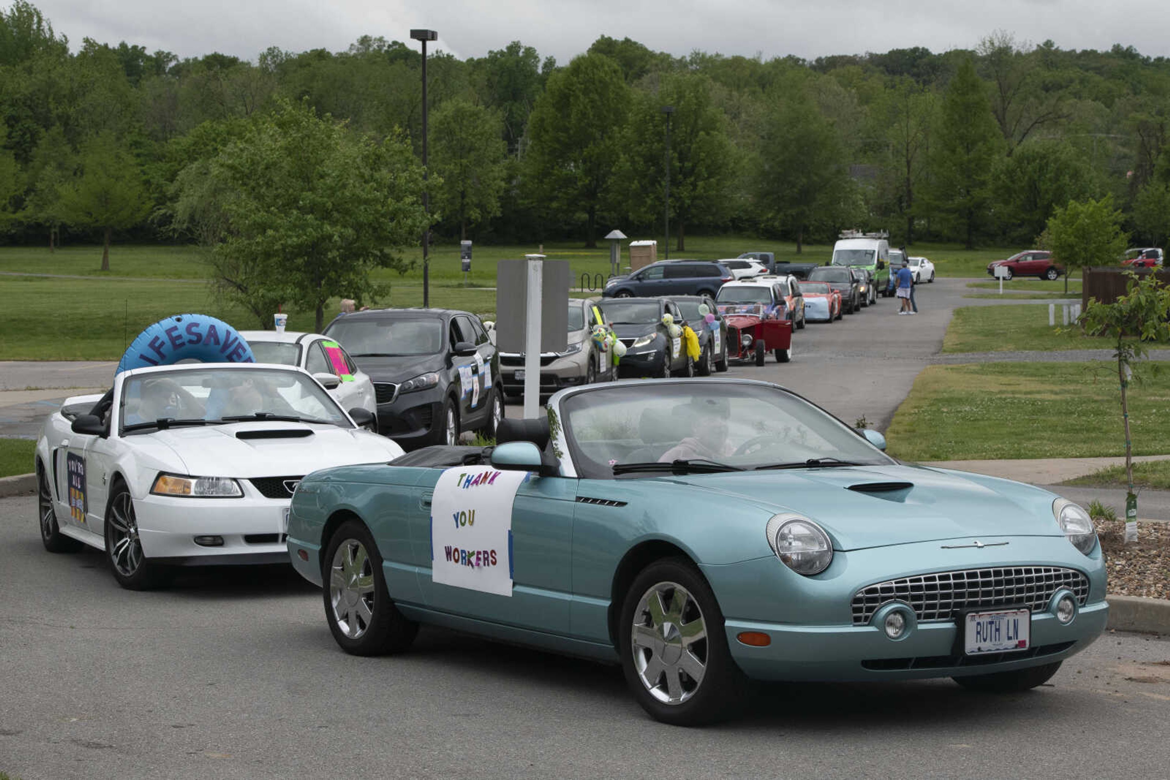 Ruth Ellen Holdman of Cape Girardeau (in front vehicle), with the River City Rodders, waits for the start of the United Way of Southeast Missouri's #GiveUnitedCarParade on Tuesday, May 5, 2020, at the Osage Centre in Cape Girardeau.