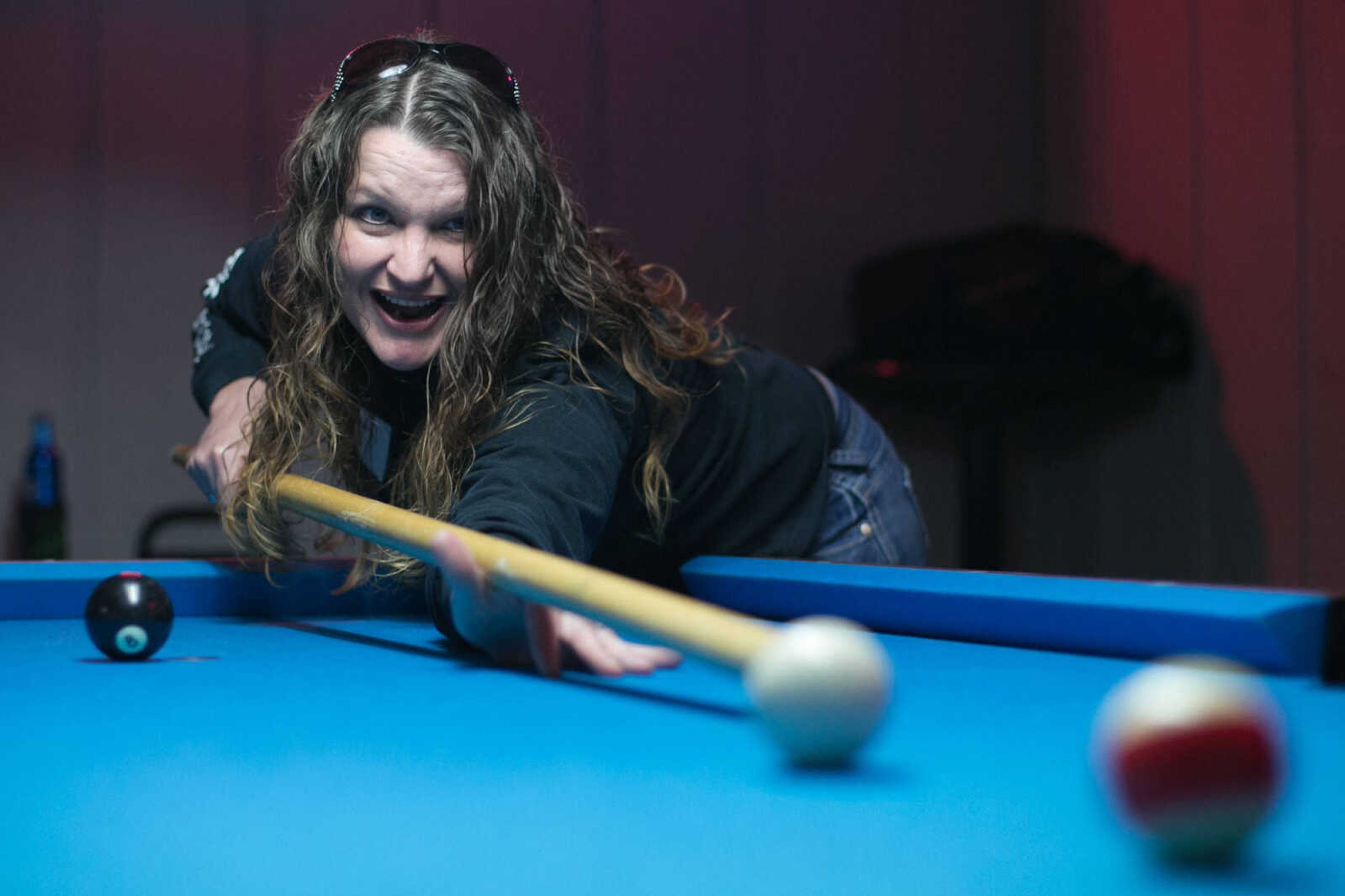 GLENN LANDBERG ~ glandberg@semissourian.com

Sarah Pohlman uses a broomstick to line up a shot during the annual broomstick pool tournament Saturday, Feb. 27, 2016 at JR's Bar & Billiards in Cape Girardeau. The tournament was sponsored by Local 16 SEMO, Freedom of Road Riders Inc.