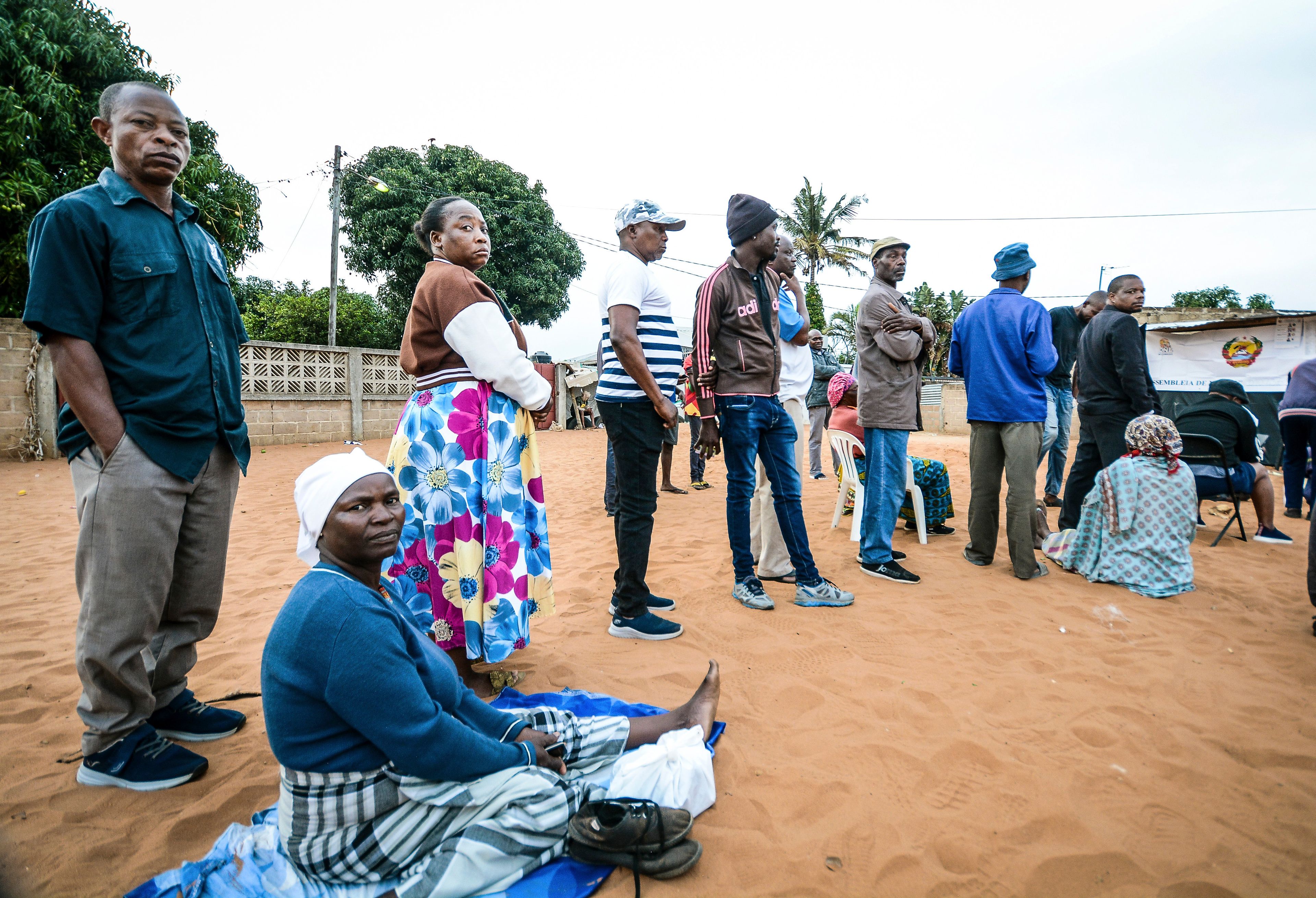 People queue to cast their votes during general elections in Maputo, Mozambique, Wednesday, Oct. 9, 2024. (AP Photo/Carlos Equeio)