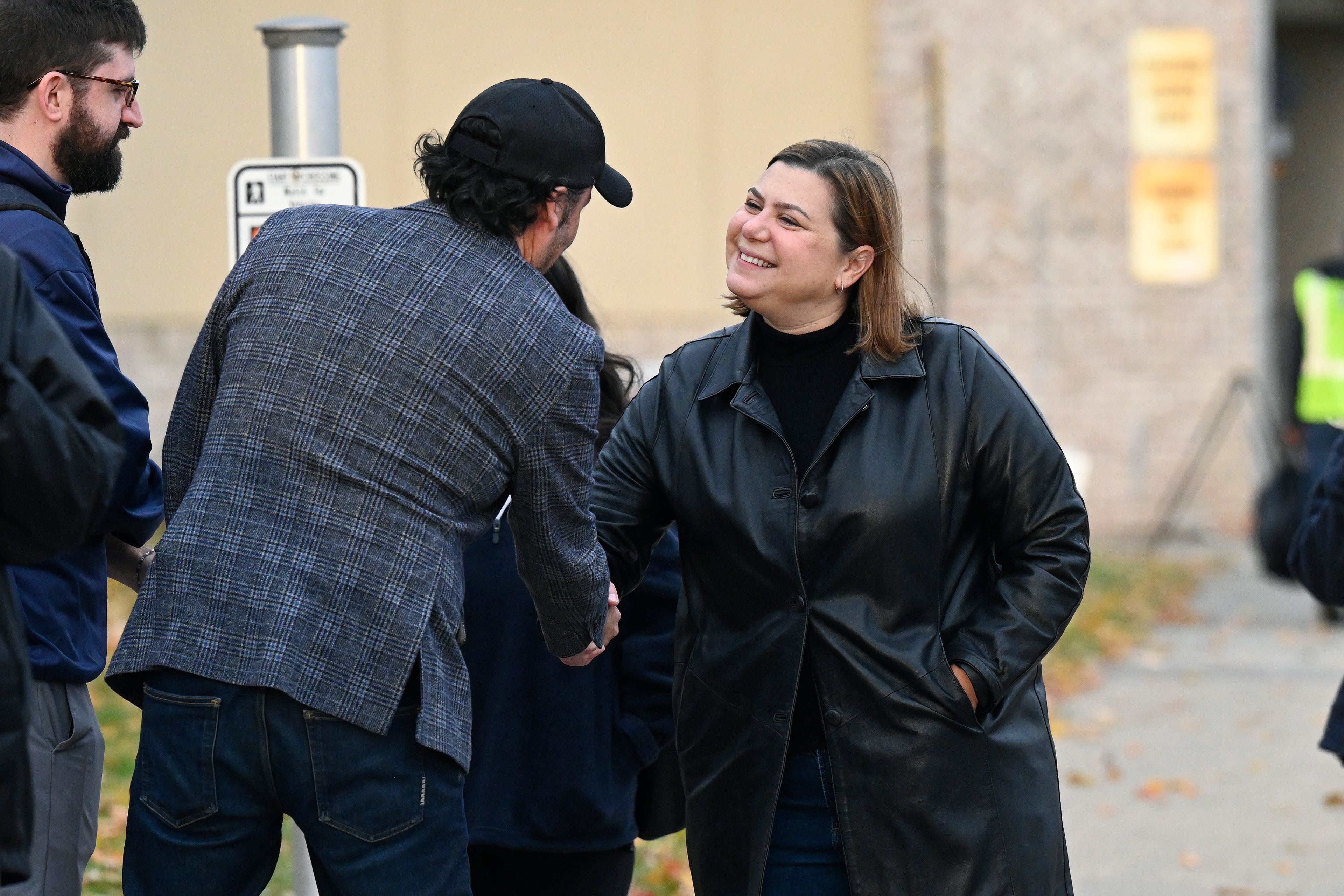 Democratic Michigan Senate candidate Rep. Elissa Slotkin, right, greets supporters outside Edison Elementary School, Tuesday, Nov. 5, 2024, in Detroit. (AP Photo/Jose Juarez)