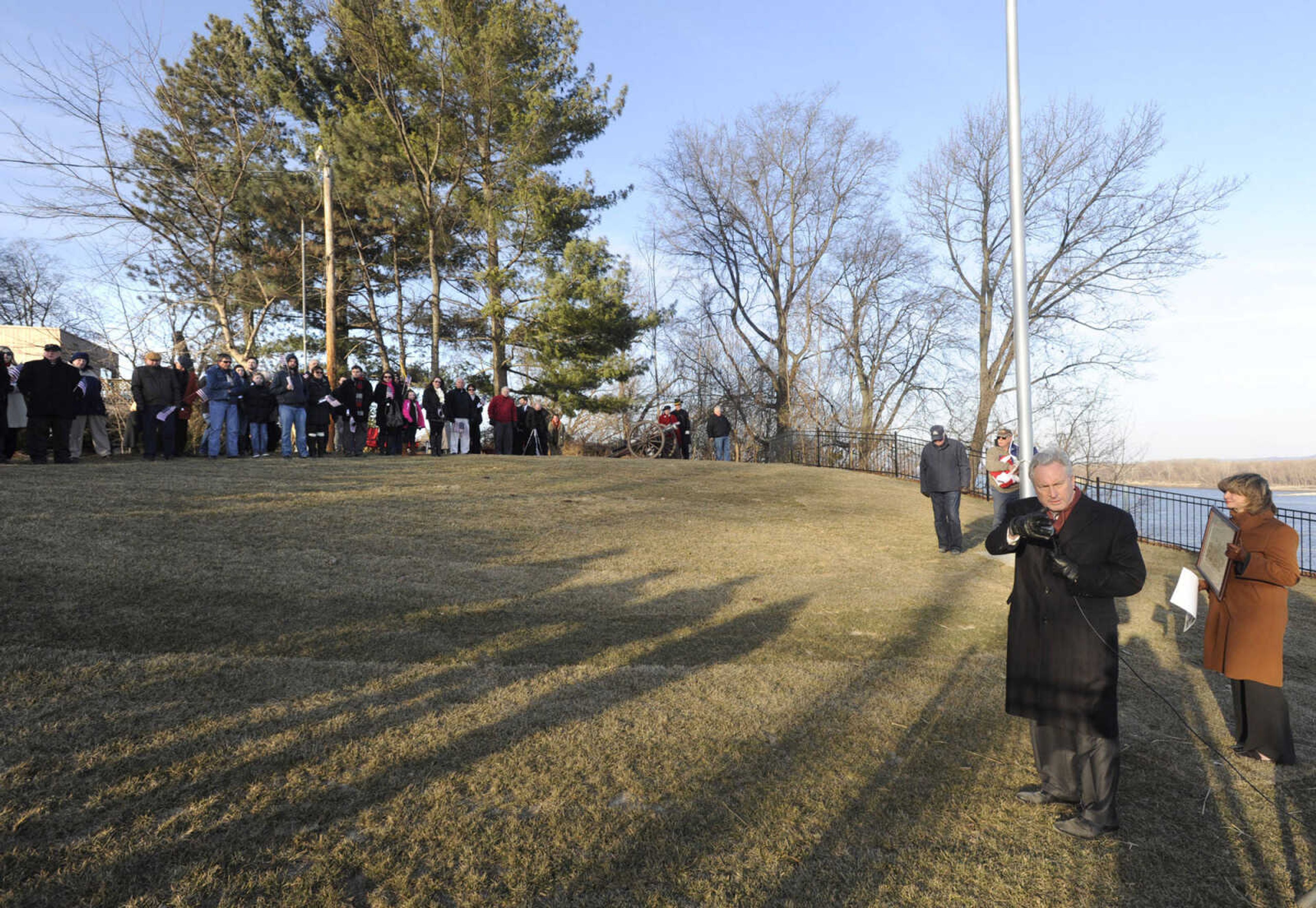 U.S. District Judge Stephen N. Limbaugh Jr. discusses the renovation of the Fort A site as his wife, Marsha Limbaugh, listens with the crowd Friday, Feb. 13, 2015 in Cape Girardeau.