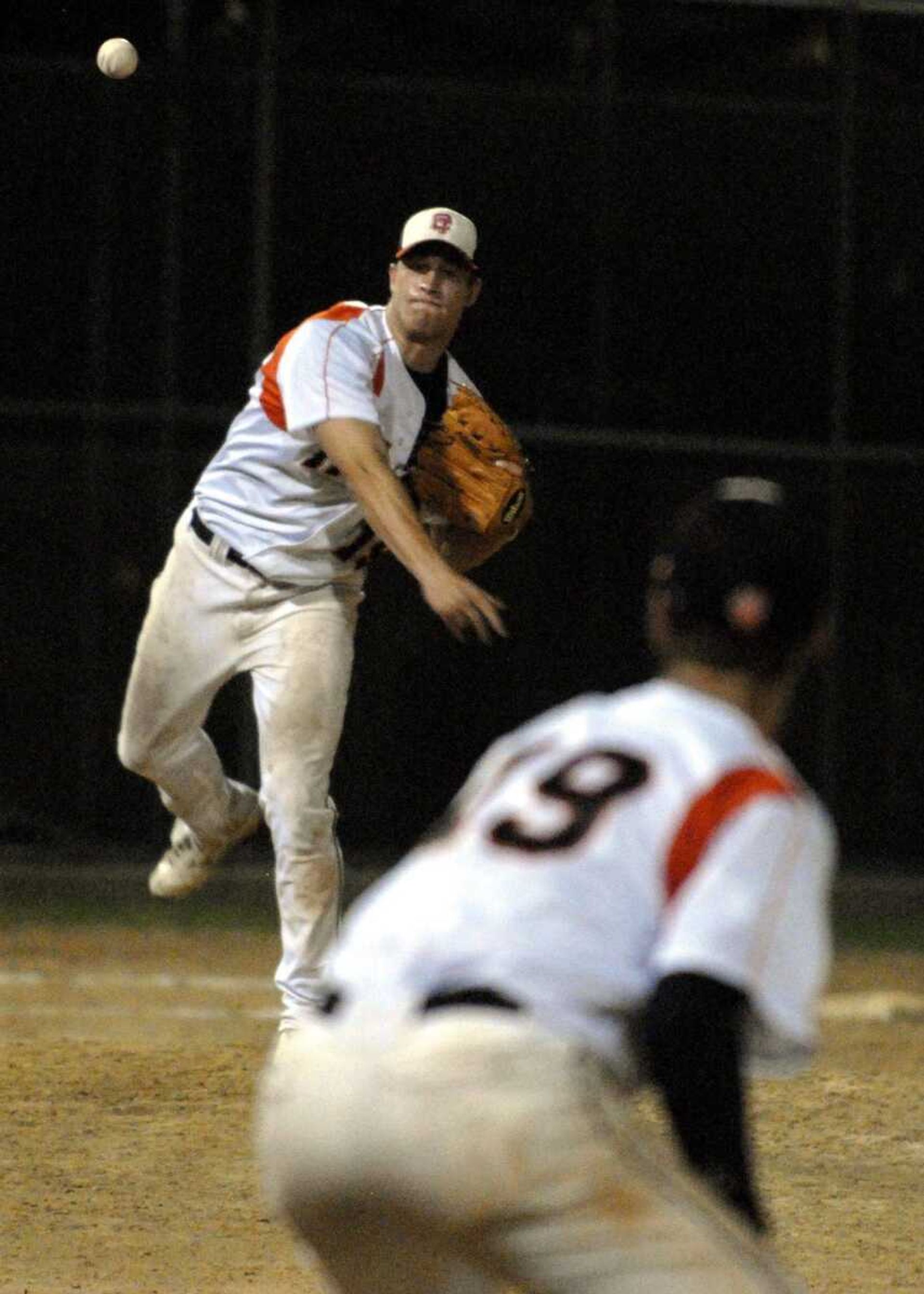 Central pitcher Andrew Hileman throws to first baseman Andrew Williams on a pickoff attempt in a game earlier this seson. (Laura Simon)