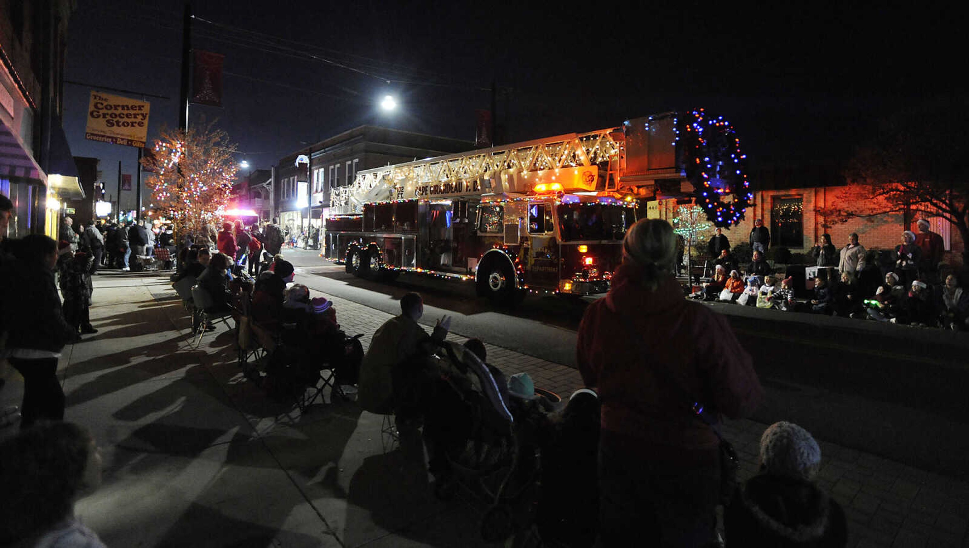 A ladder truck from the Cape Girardeau Fire Department at the front of the 21st Annual Parade of Lights Sunday, Nov. 25, moves down Broadway in Cape Girardeau. This year's theme was "All I Want for Christmas."