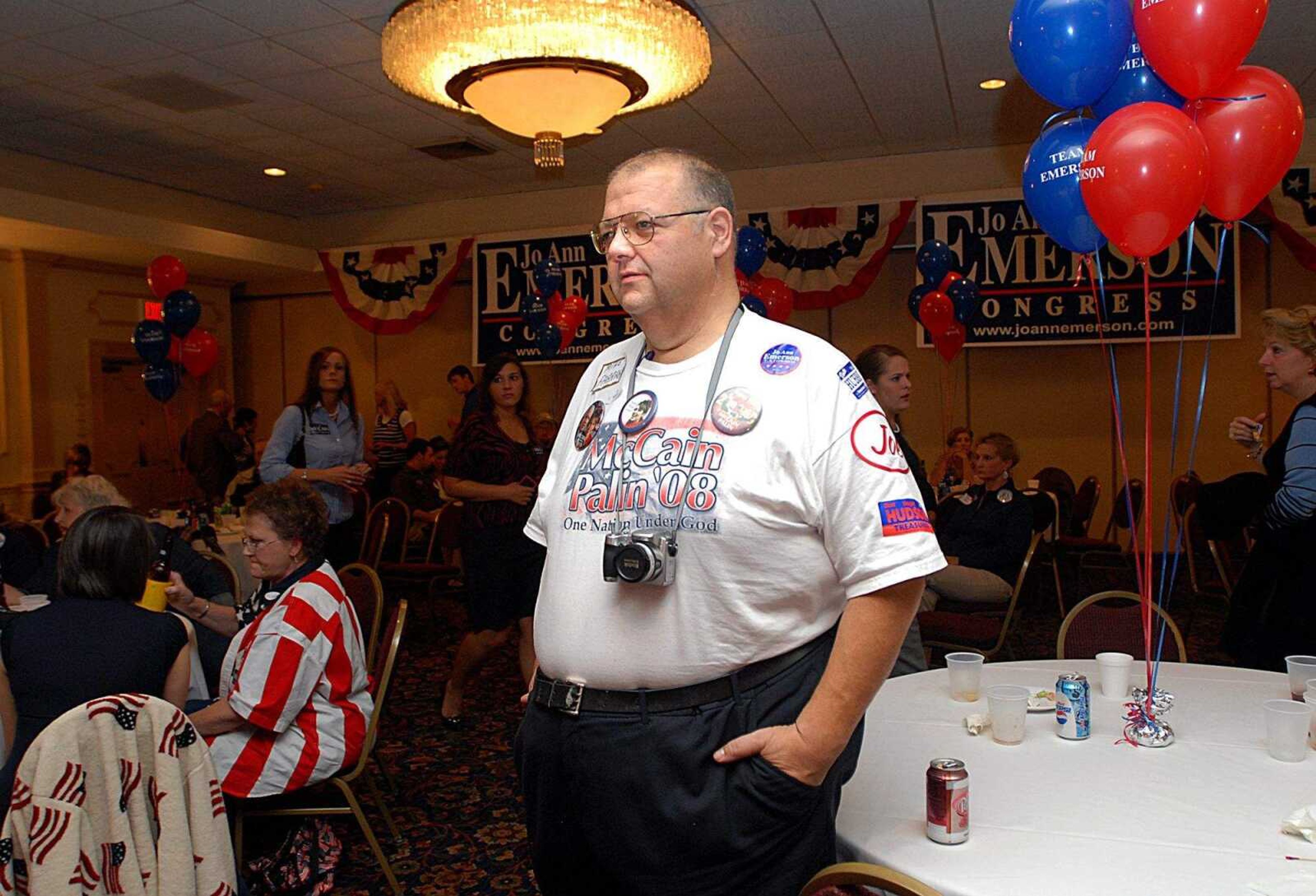 AARON EISENHAUER ~ aeisenhauer@semissourian.com
Decked out in stickers, buttons and a t-shirt in support of Republican candidates, Mike Farrar watches election results at Jo Ann Emerson's watch party.