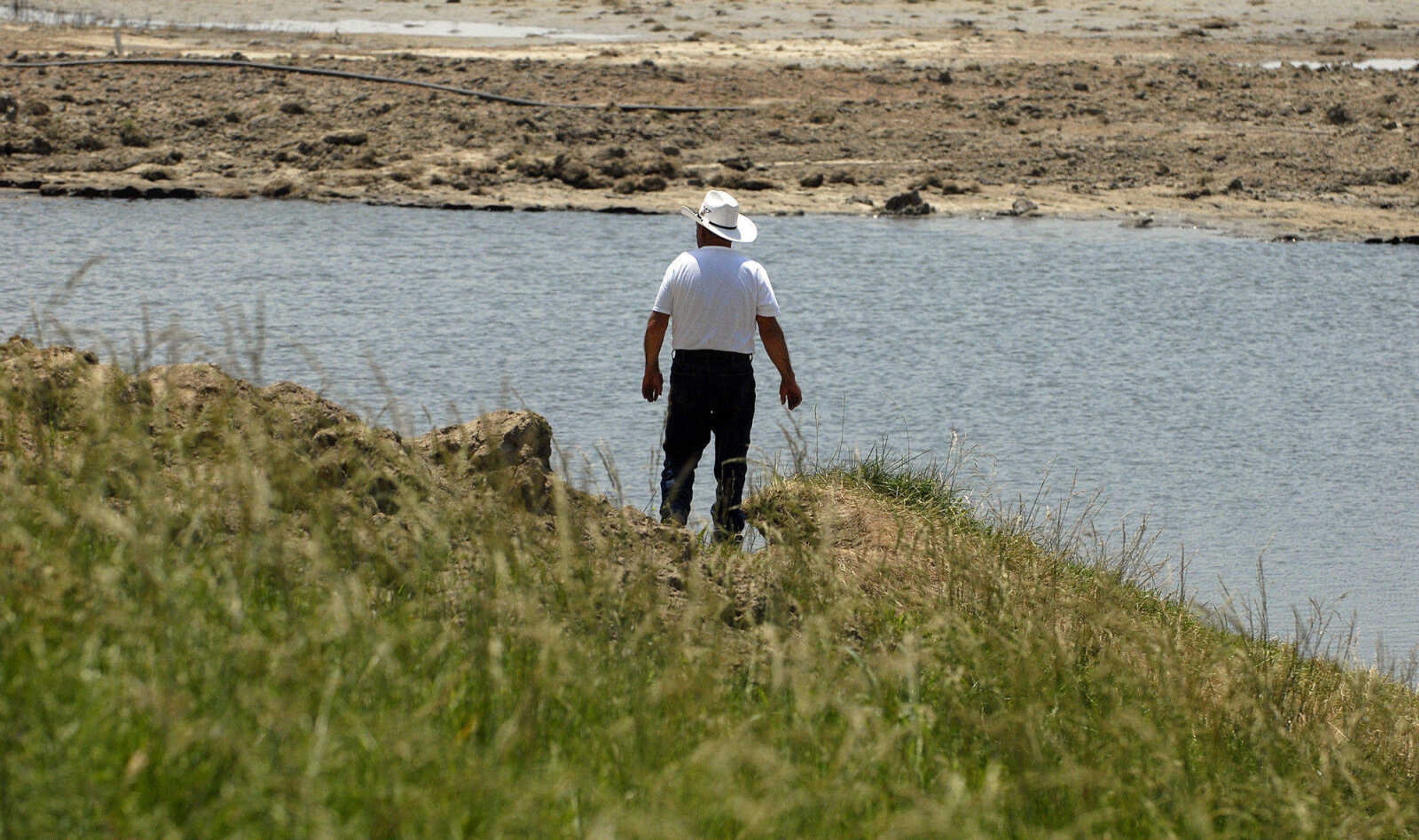 Bobby Carter looks out over the breached Birds Point levee Wednesday, June 1, 2011. (Laura Simon)