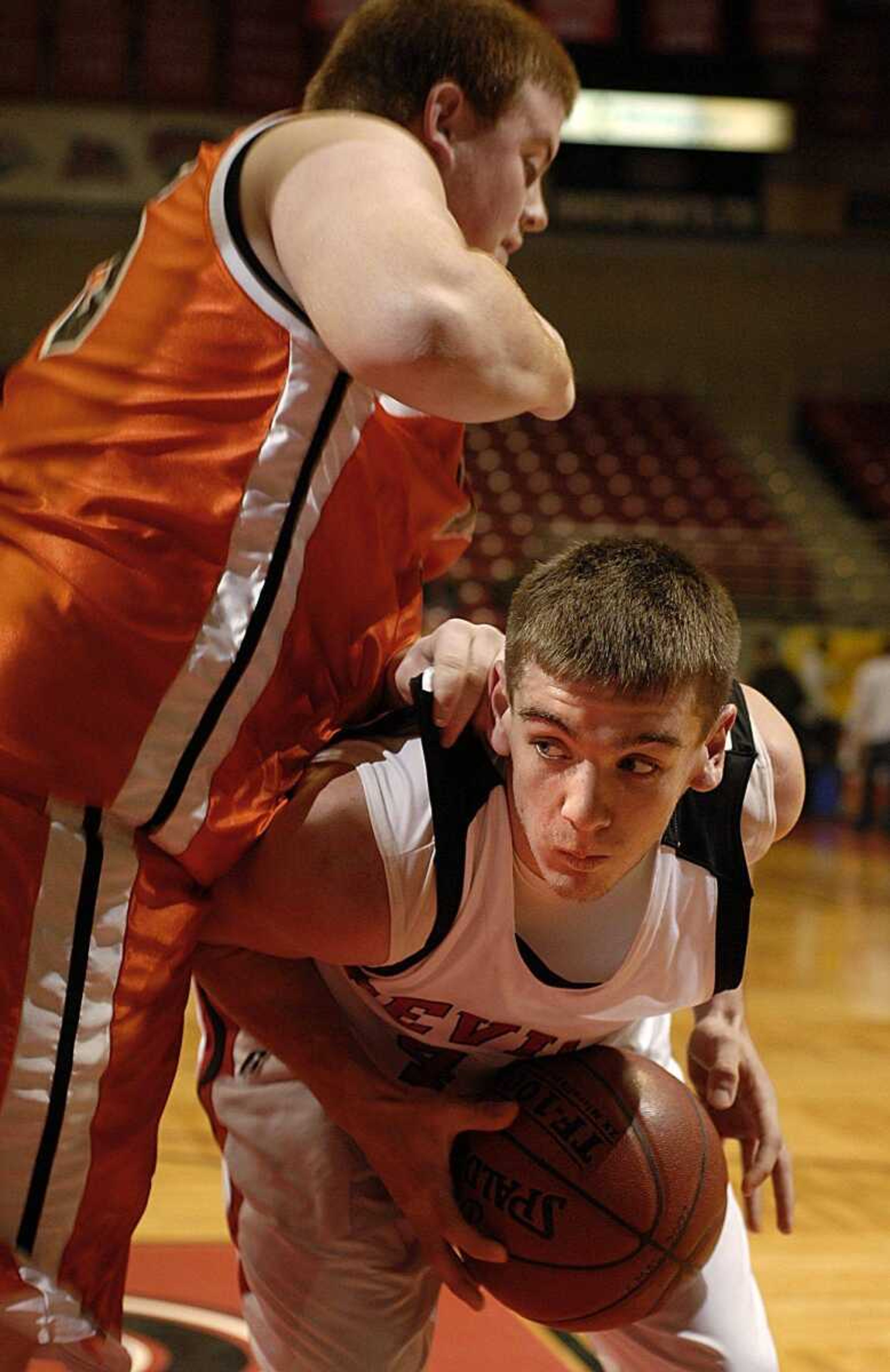 Chaffee's Andy Hendrix protected the ball while being defended by an Advance player during consolation action.  Advance hit a late shot to eliminate Chaffee 59-58. (Aaron Eisenhauer)