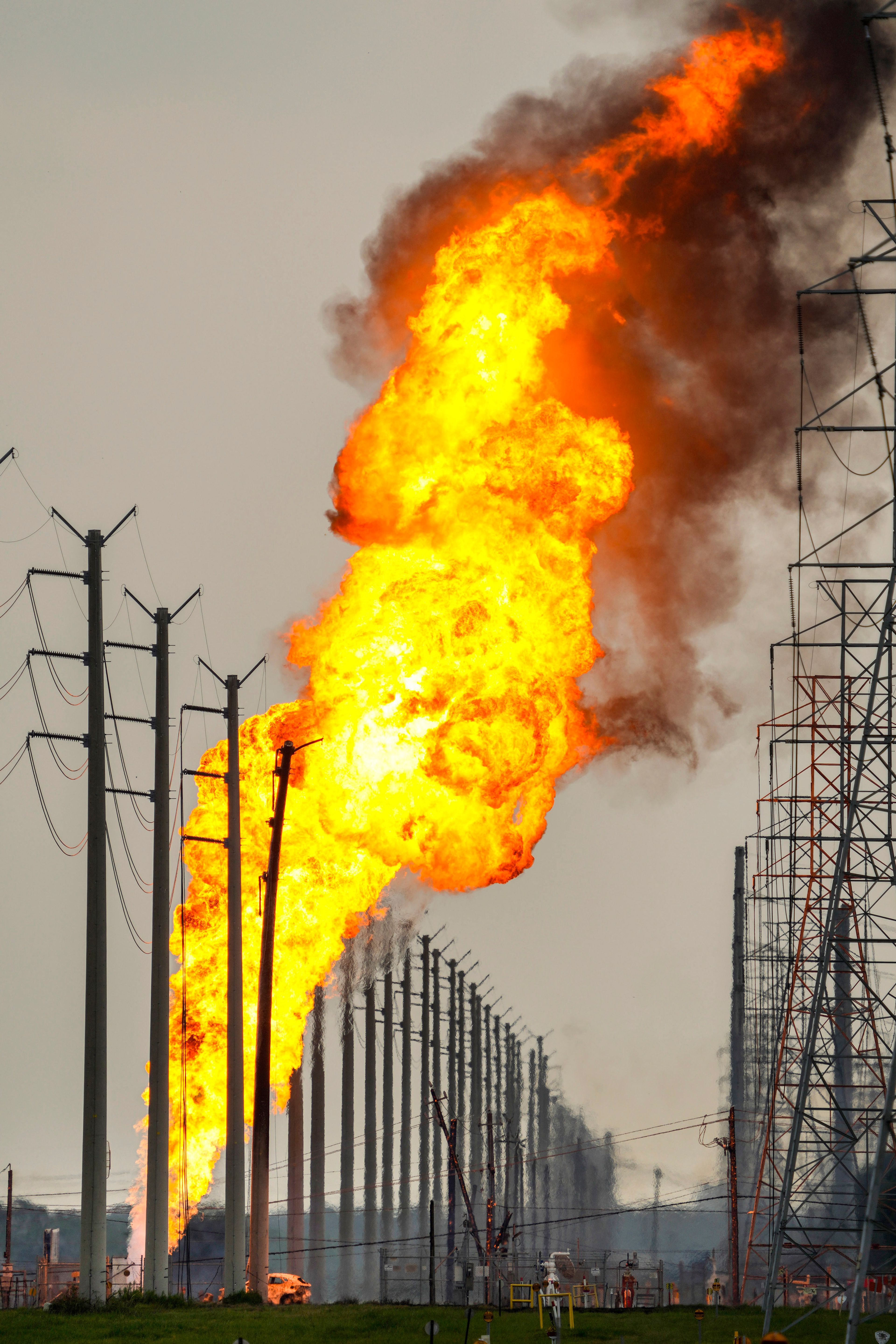 A pipeline carrying liquified natural gas burns near Spencer Highway and Summerton on Monday, Sept. 16, 2024, in La Porte, Texas. (Brett Coomer/Houston Chronicle via AP)