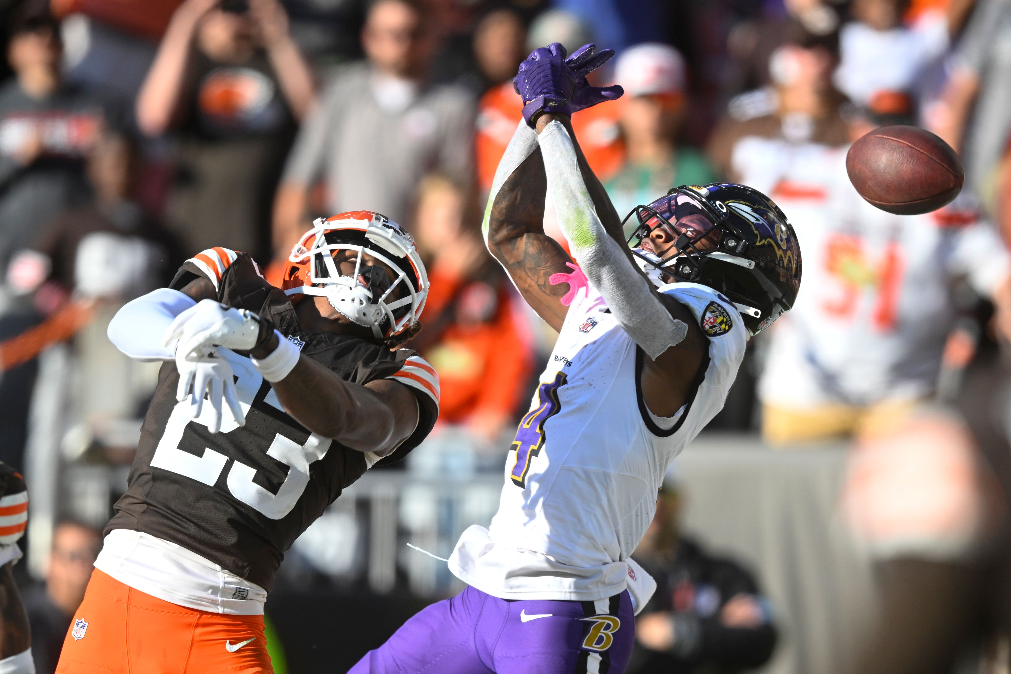 Baltimore Ravens wide receiver Zay Flowers (4) drops a pass in the end zone with Cleveland Browns cornerback Martin Emerson Jr. (23) in the finals second of the second half of an NFL football game in Cleveland, Sunday, Oct. 27, 2024. (AP Photo/David Richard)