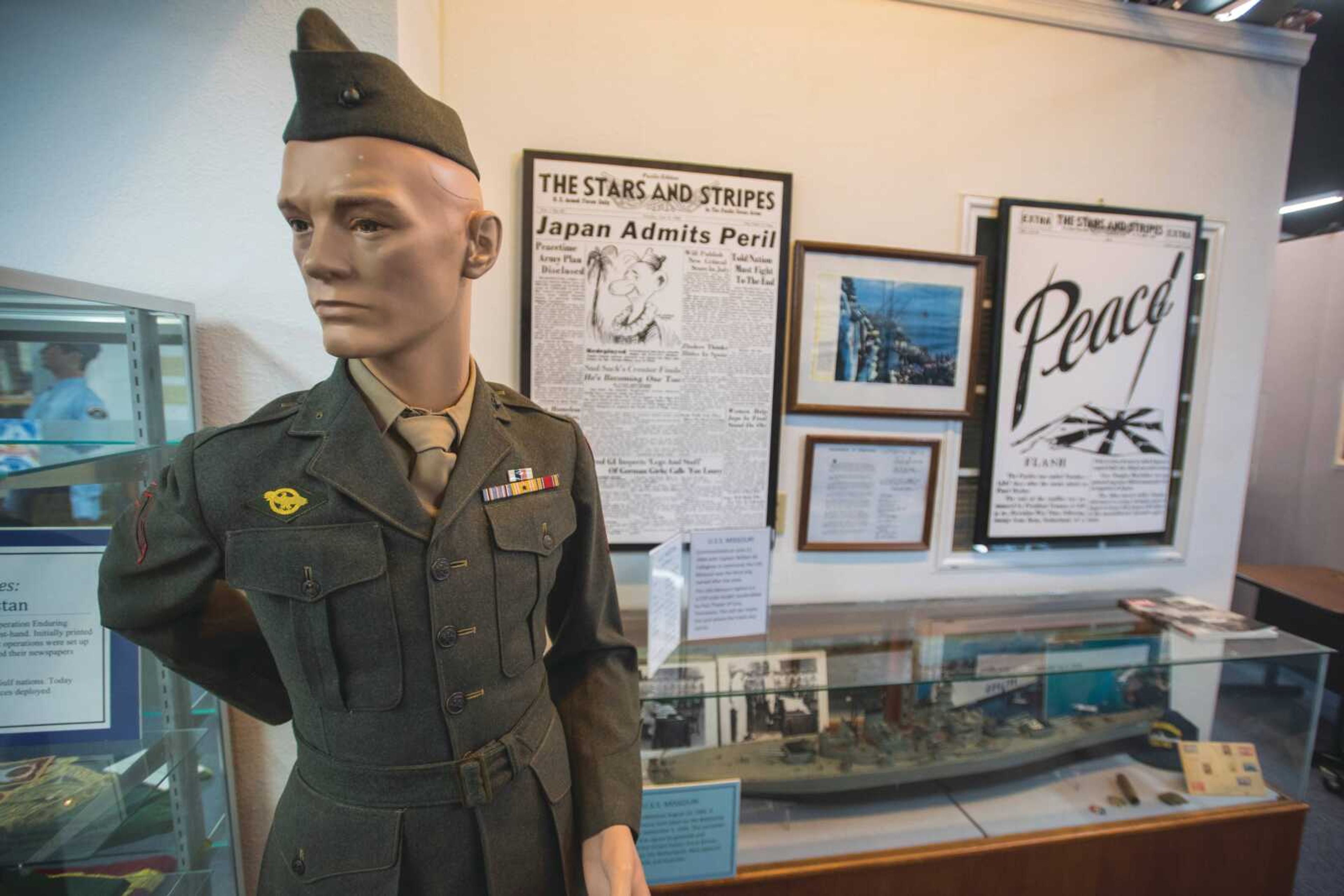 A mannequin wearing a World War II-era service uniform stands at the entrance to the World War II exhibit at the National Stars and Stripe Museum and Library in Bloomfield, Missouri.