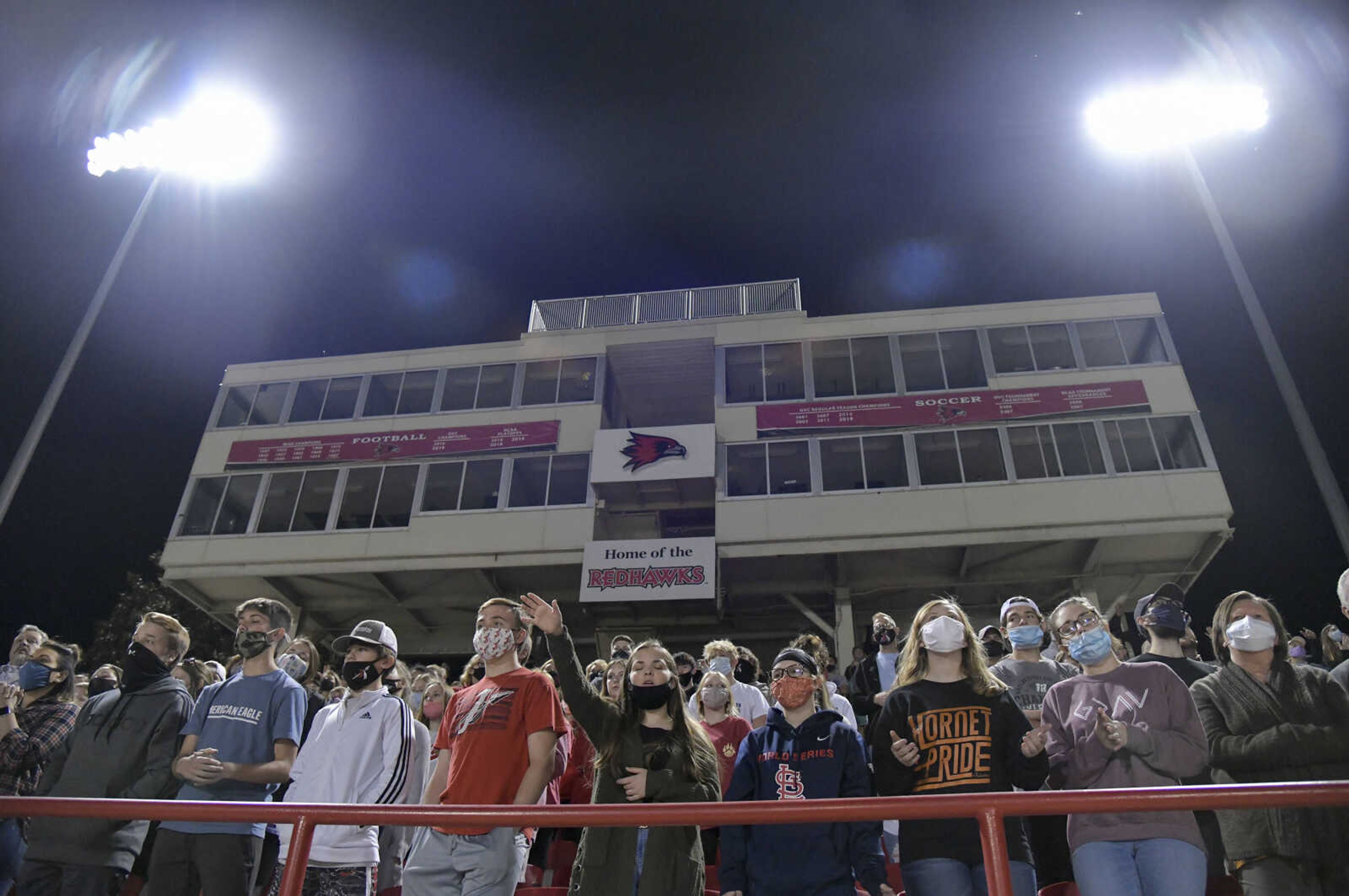 Attendees of the Fields of Faith event watch as the Worship Band performs at Houck Stadium in Cape Girardeau on Wednesday, Oct. 14, 2020.