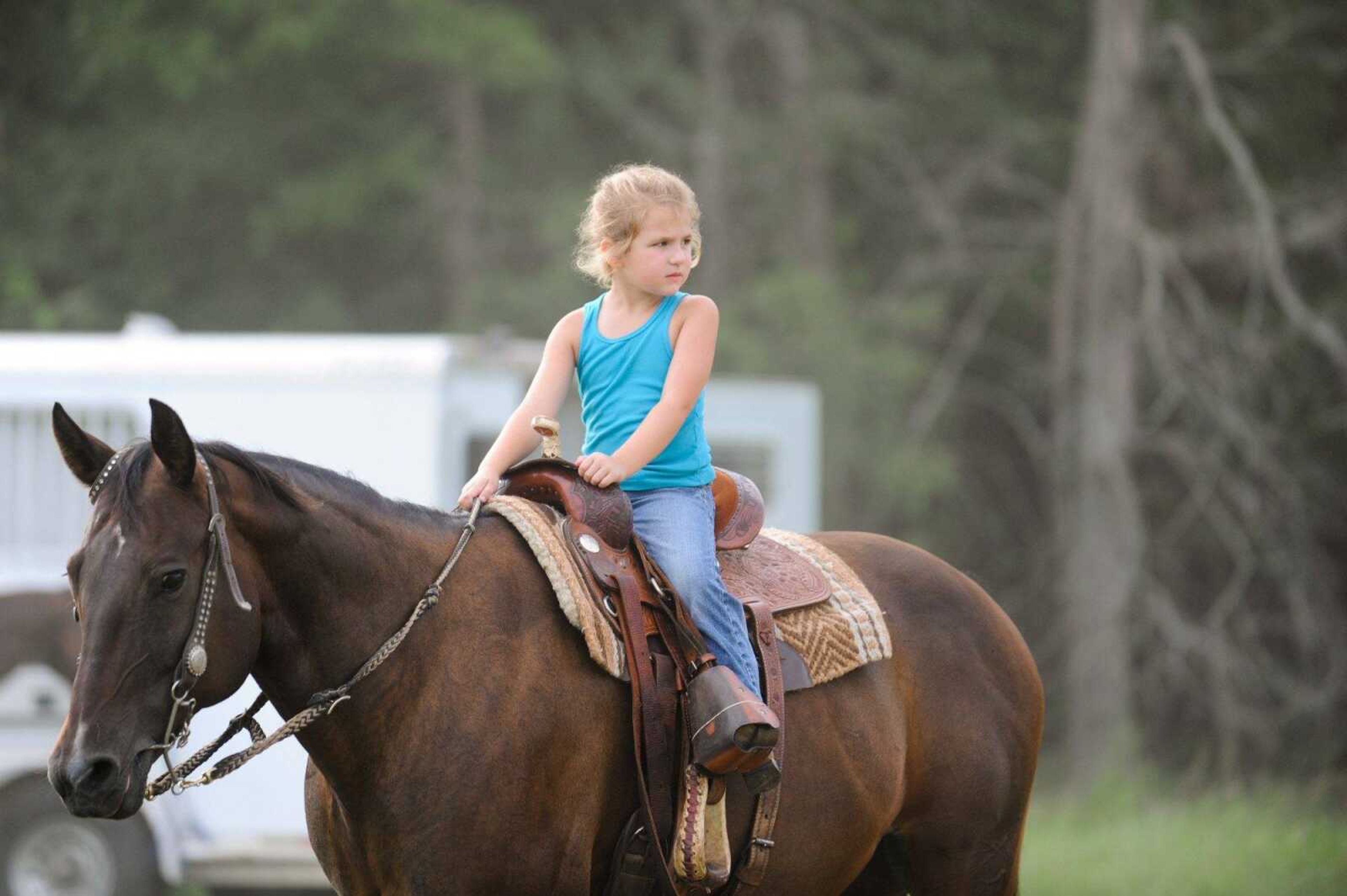 Kate Chappell, 5, warms up with Sydney before a barrel race Saturday evening at the Rockin' JK Arena. (Glenn Landberg)