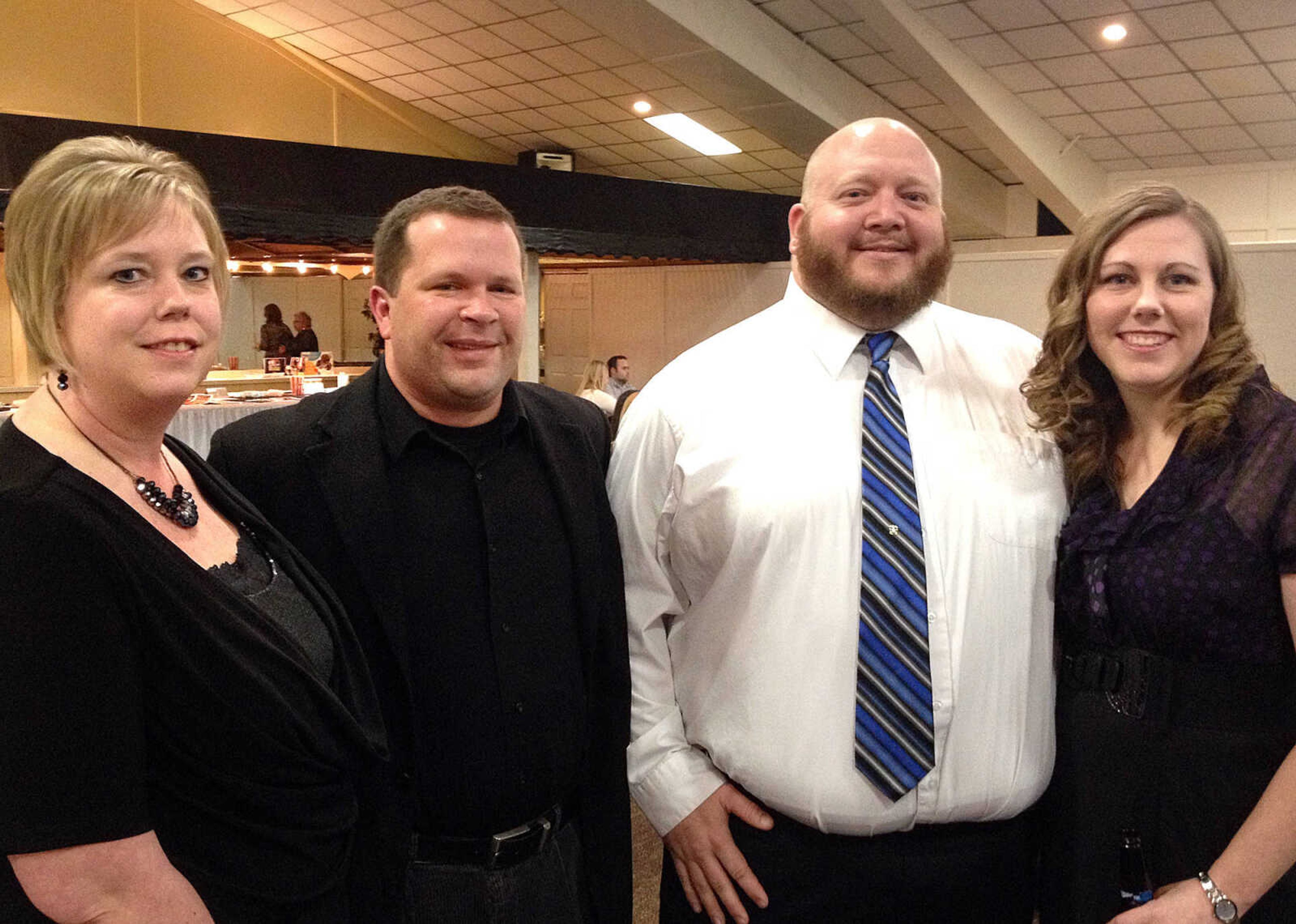 Jill Reith, left, John Reith with The Wright Group, Darren Burgfeld with Element 74 and Carrie Burgfeld.