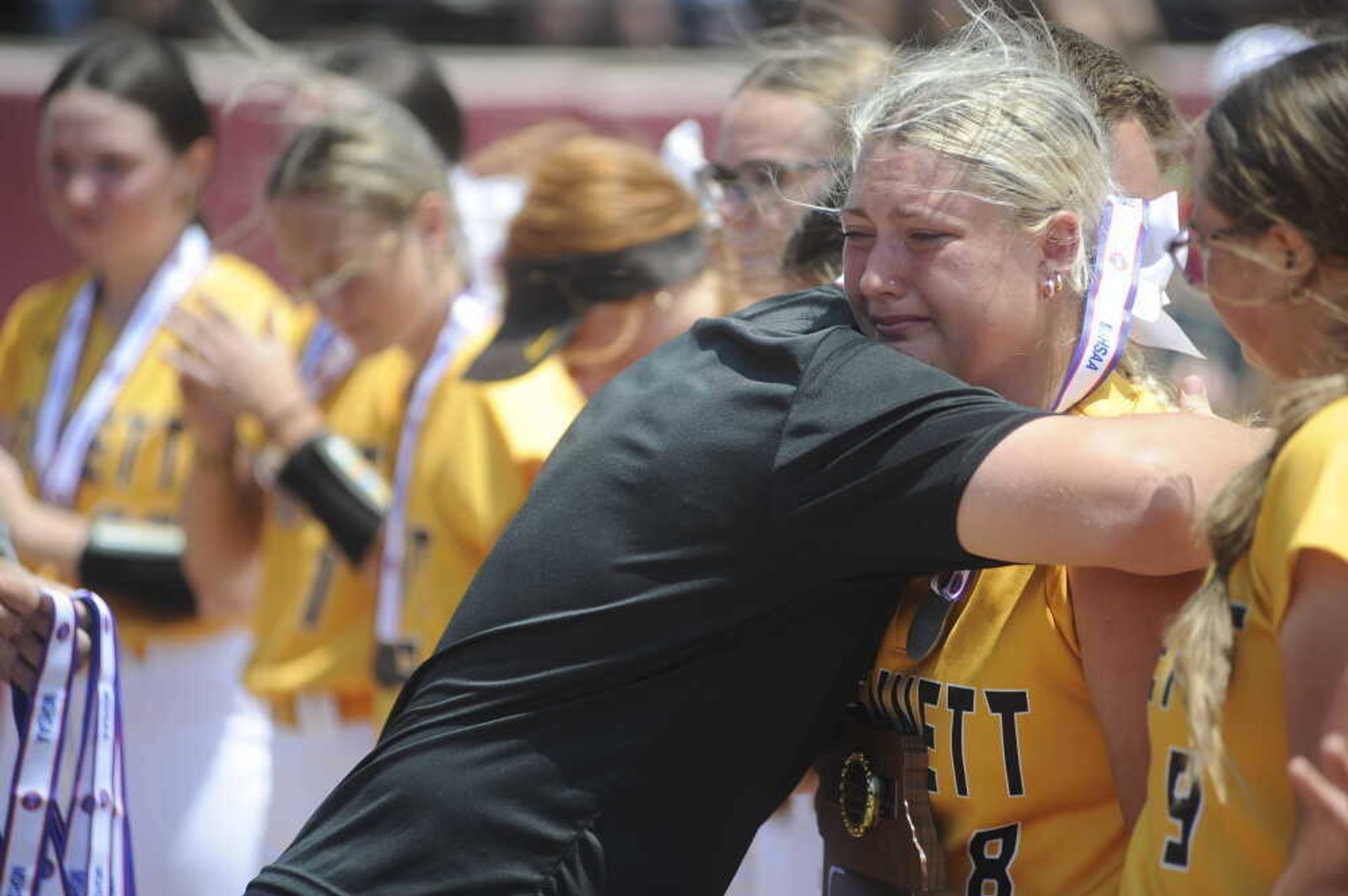 A bittersweet moment at state finds Bootheel Conference Coach of the Year Logan Dollins hugging senior Hadley Wilson at the Killian Sports Complex at Springfield. Wilson concluded her high school career with school record-setting 199 RBIs and 210 hits for the Lady Indians.