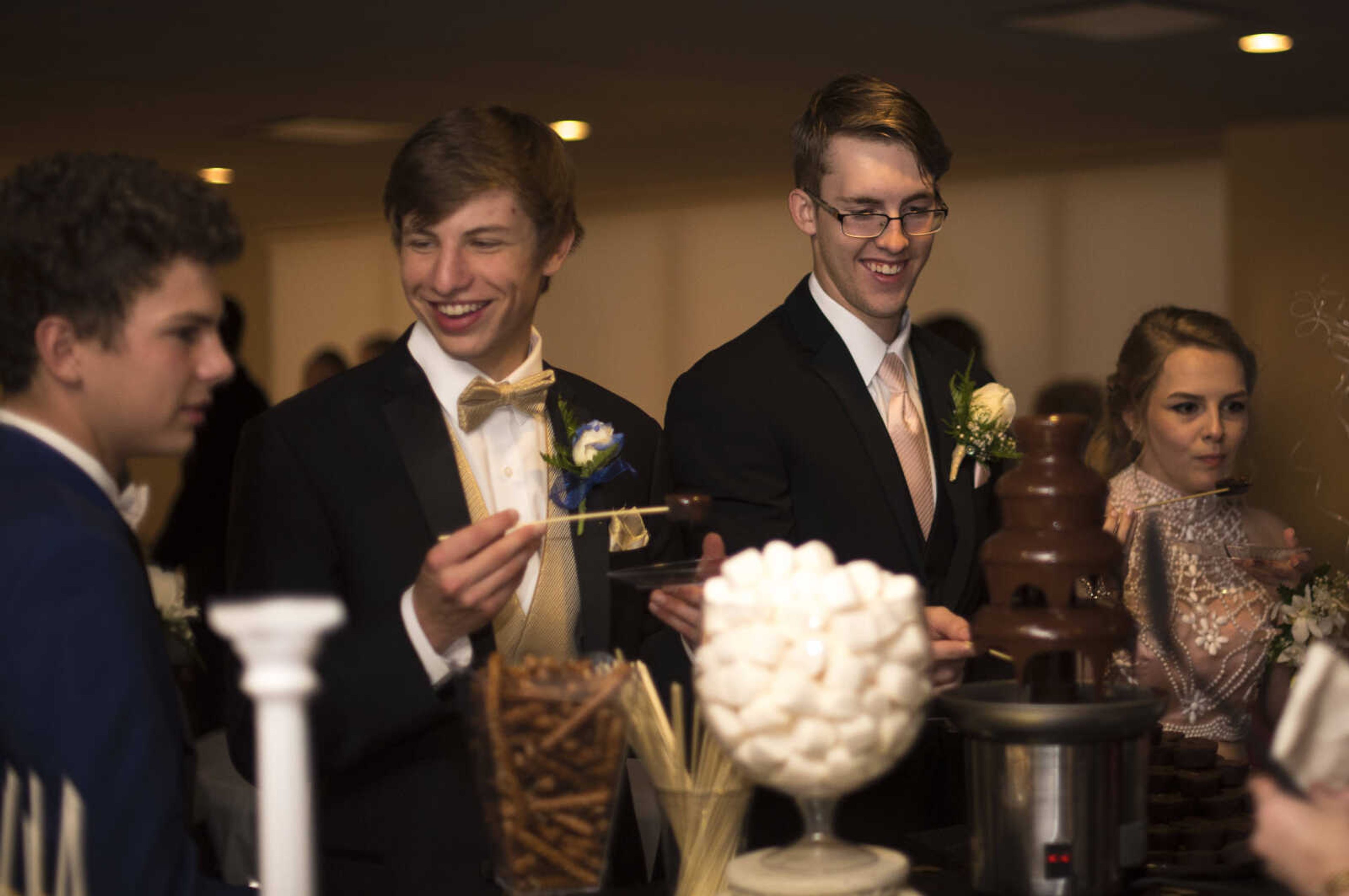 Students wait for refreshments during the Saxony Lutheran prom Saturday, April 22, 2017 at the Elk's Lodge in Cape Girardeau.