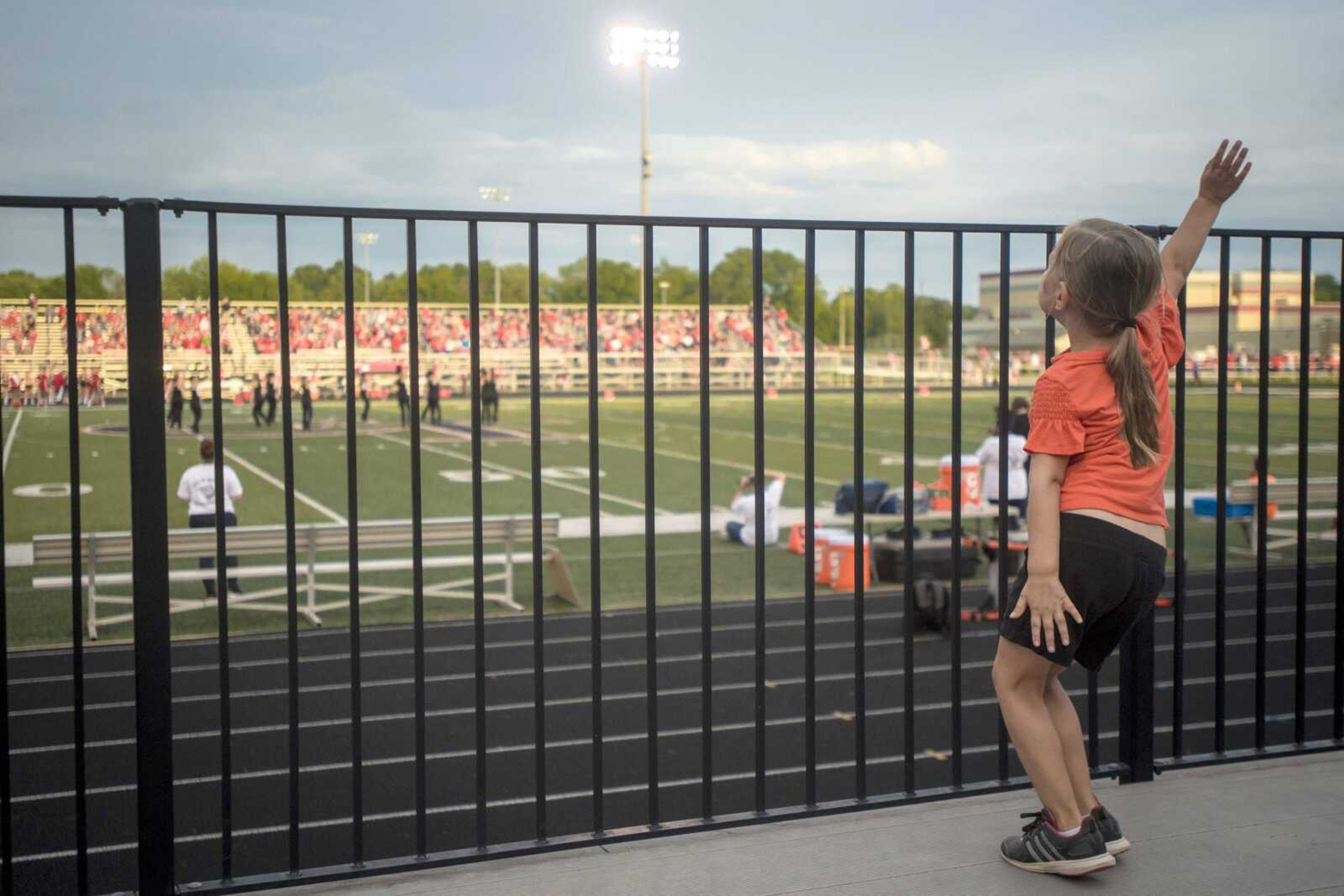 Chloe Keys, 5, dances in the stands while watching the Cape Central dance team perform before the Tigers' first home football game.