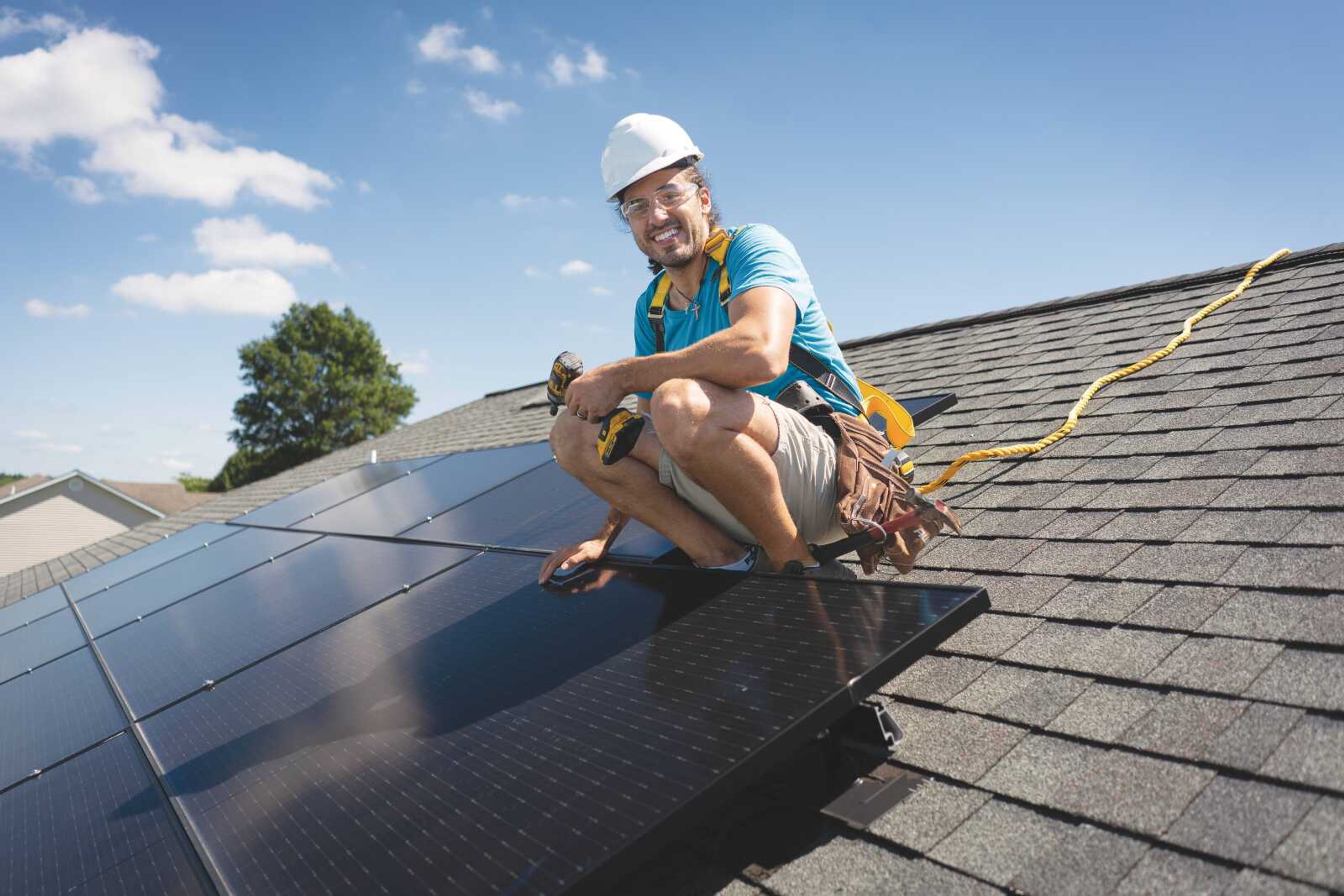 Jake Long of Jackson Solar LLC  pauses for a photo on a customer's roof in Jackson. 