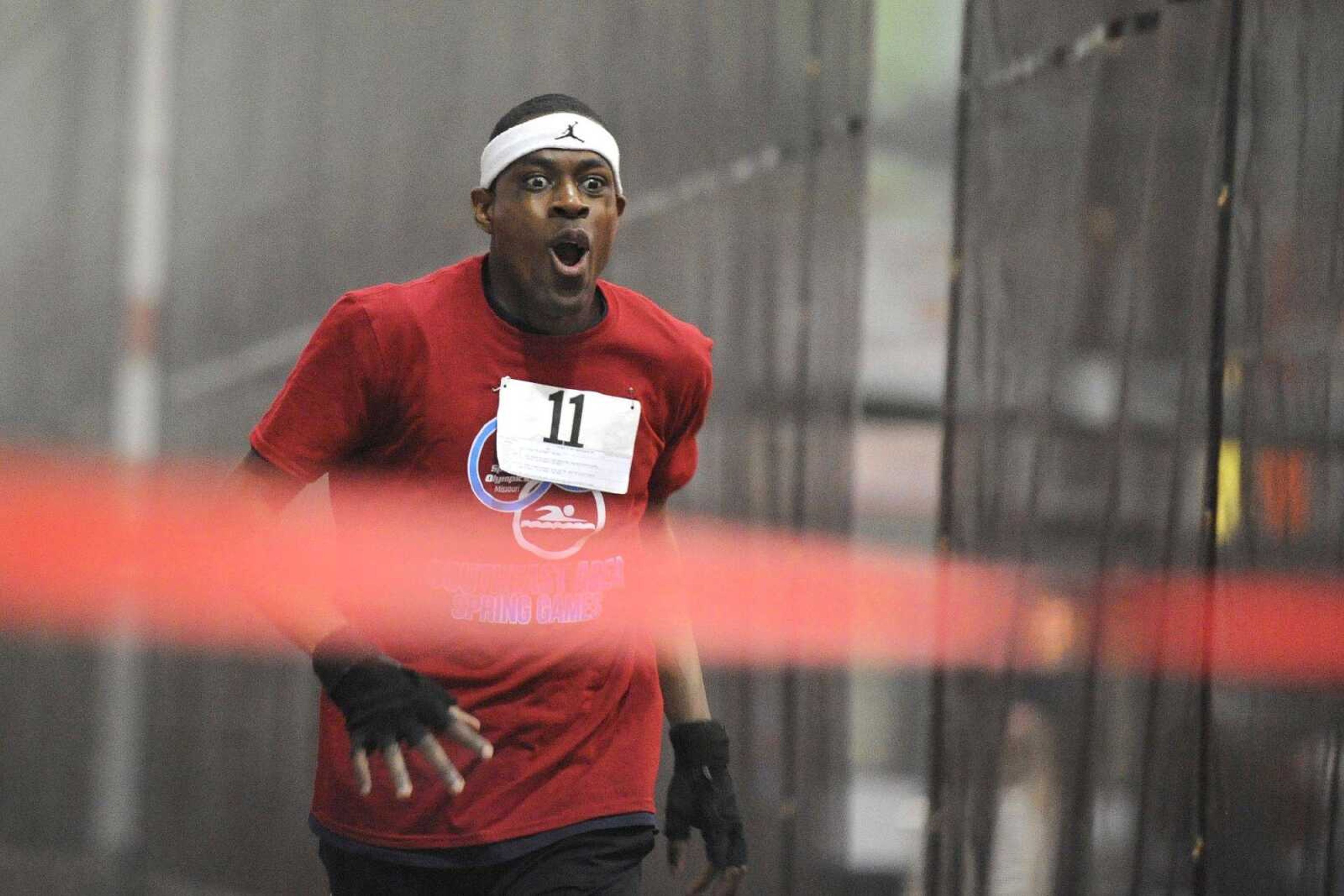 Derrick Liddell makes the final push for a first-place finish in the 400-meter race during the Missouri Special Olympics Southeast Area Spring Games on Saturday at the Student Recreation Center of Southeast Missouri State University. More photos of the games are in a gallery at semissourian.com. (Glenn Landberg)