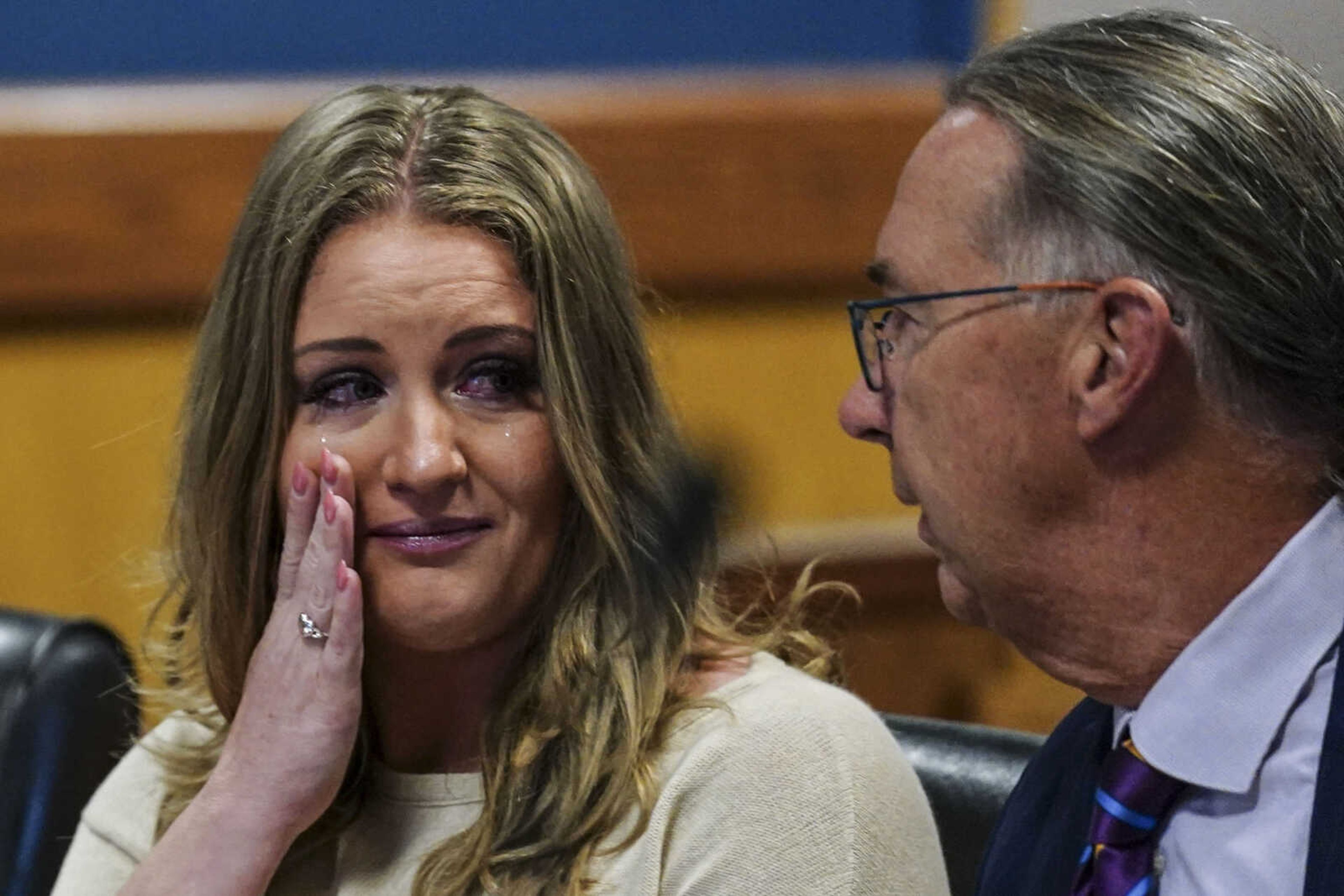 Jenna Ellis speaks with her attorney Franklin Hogue after Ellis pleaded guilty to a felony count of aiding and abetting false statements and writings Tuesday inside Fulton Superior Court Judge Scott McAfee's Fulton County Courtroom in Atlanta.