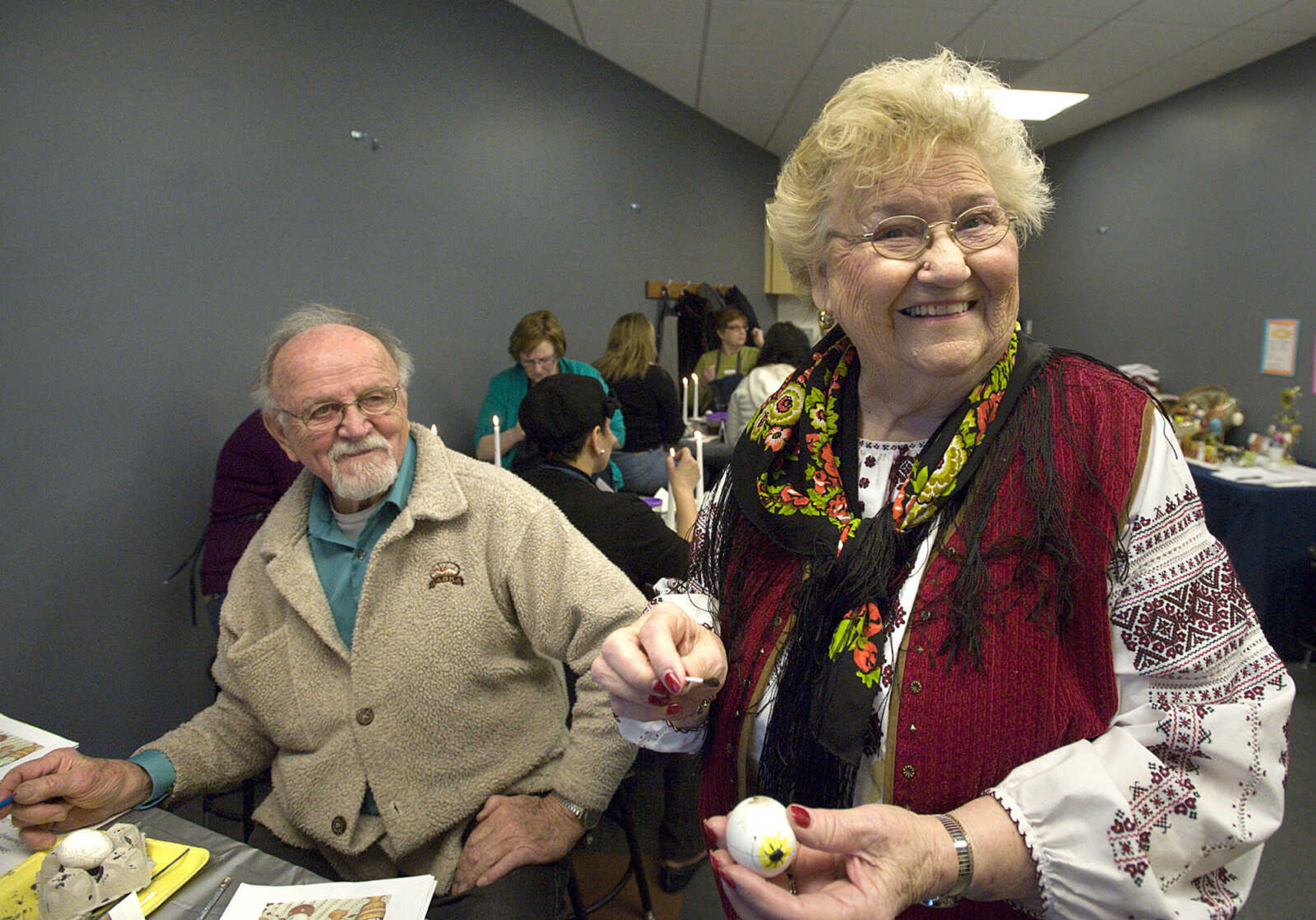 LAURA SIMON ~ lsimon@semissourian.com
Instructor Barb Duncan smiles for the camera while giving Bernard Letassy egg decorating tips Tuesday, March 19, 2013 during the Wonderful World of Pysanky workshop at Southeast Missouri State University's River Campus.