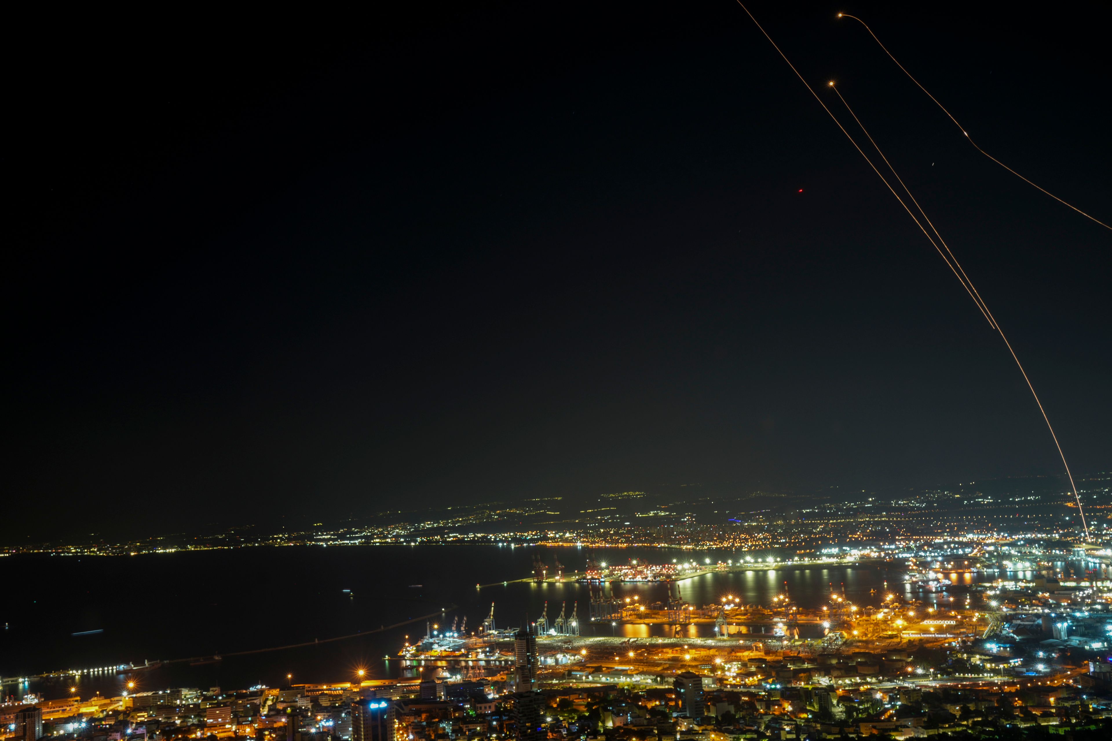 Israeli Iron Dome air defense system fires to intercept rockets that were launched from Lebanon, as seen from Haifa, northern Israel, early Saturday, Nov. 23, 2024. (AP Photo/Francisco Seco)