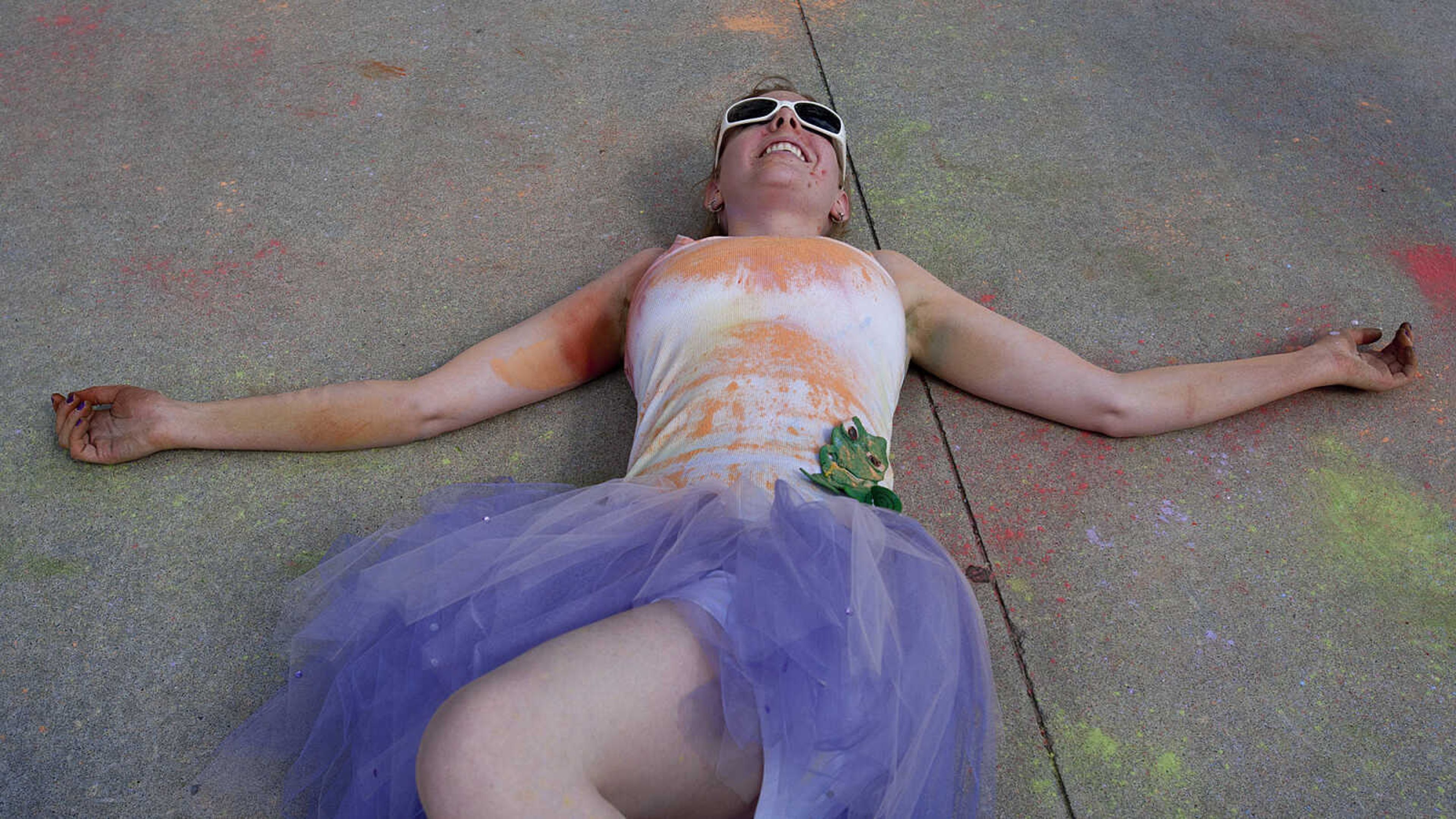 ADAM VOGLER ~ avogler@semissourian.com
Danielle Blake lies on the sidewalk after the Color Me Cape 5k Saturday, April 12, in Cape Girardeau.