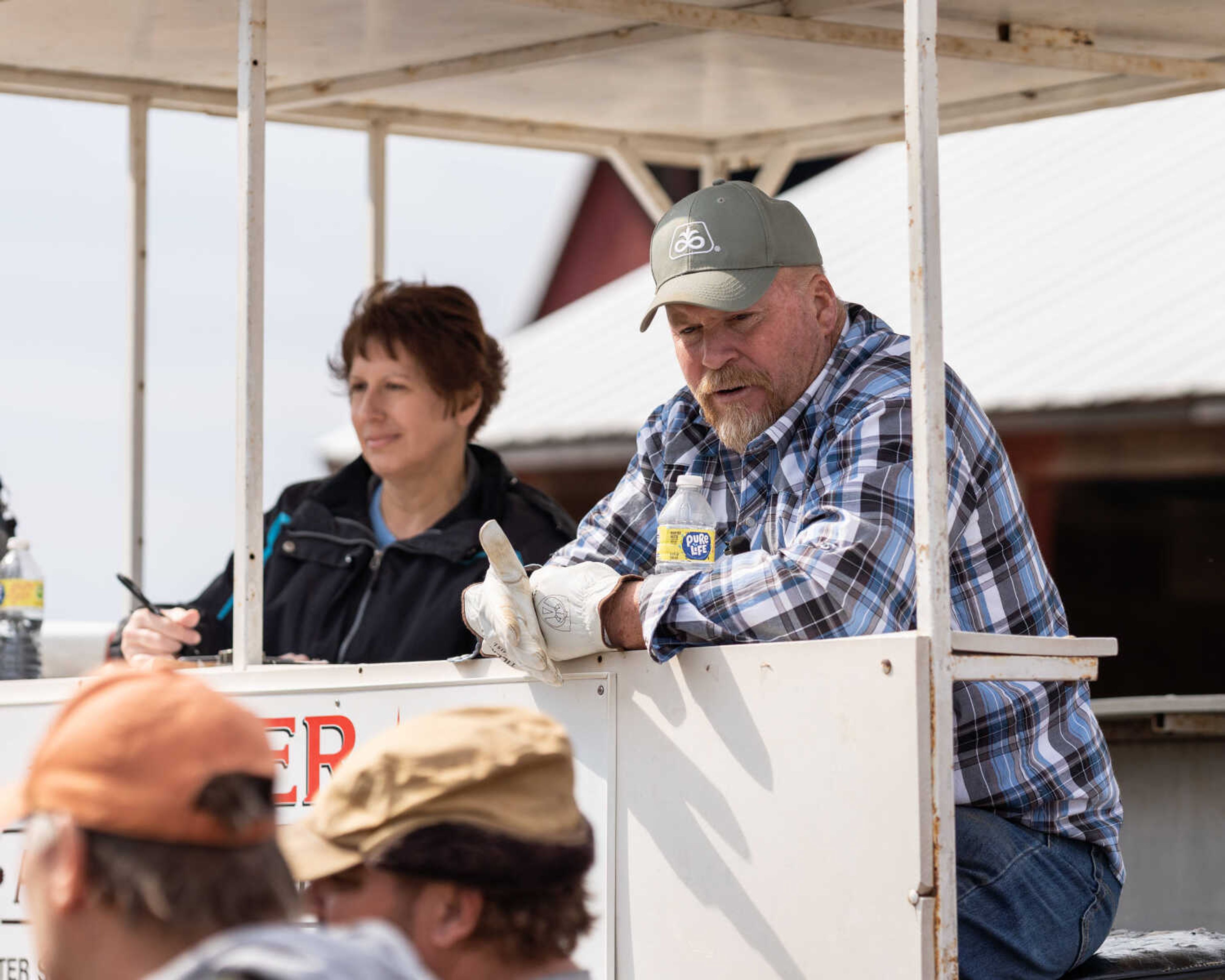 Auctioneer Chester Seyer auctions items off at an auction in the Fruitland area while Kristi Seyer clerks next to him on March 5, 2022. Chester has been an auctioneer since 2001.