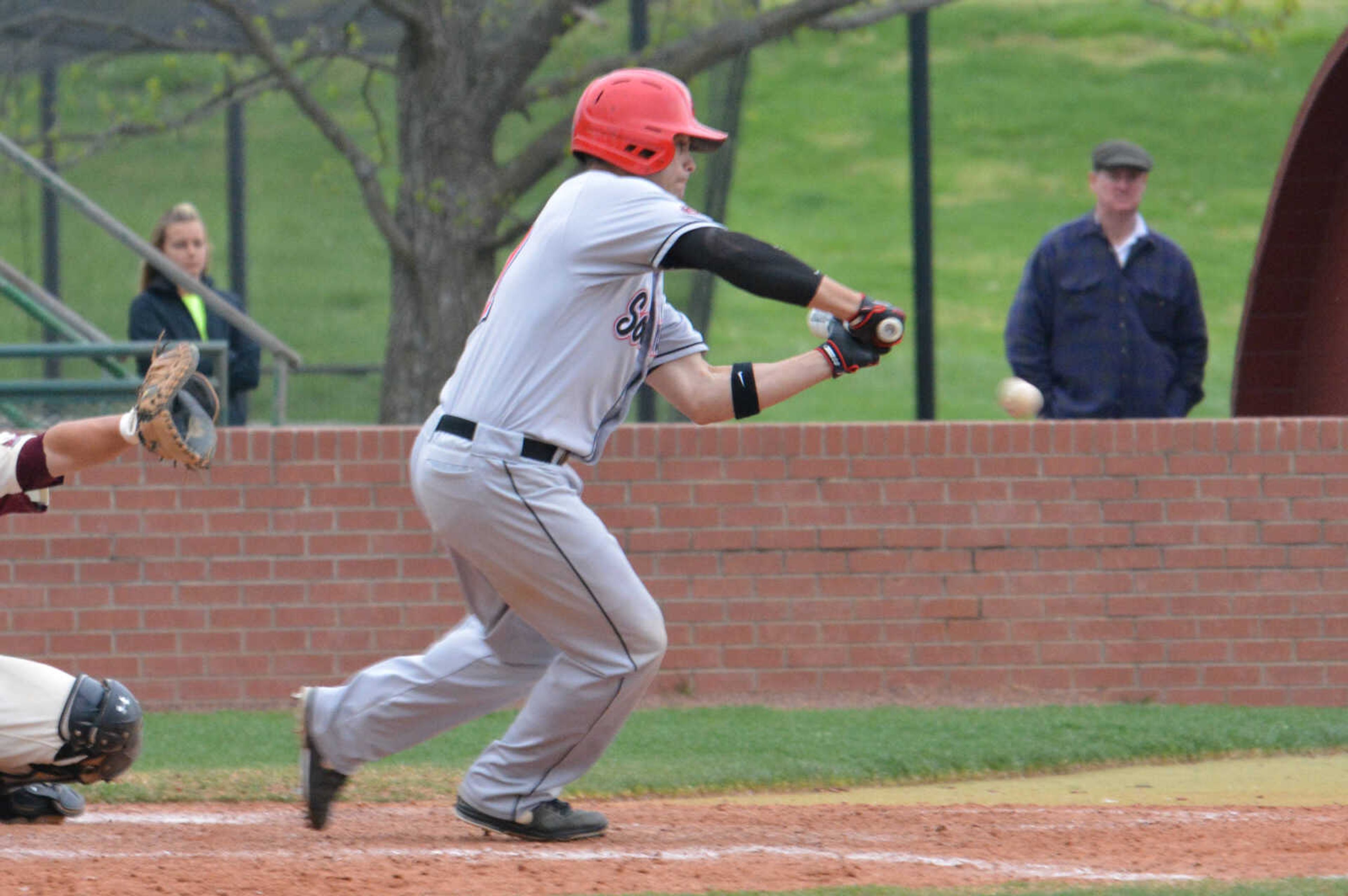 Derek Gibson bunts against SIU Carbondale on Tuesday. SIUC won 3-2 in 11 innings. (Wayne Mcpherson)