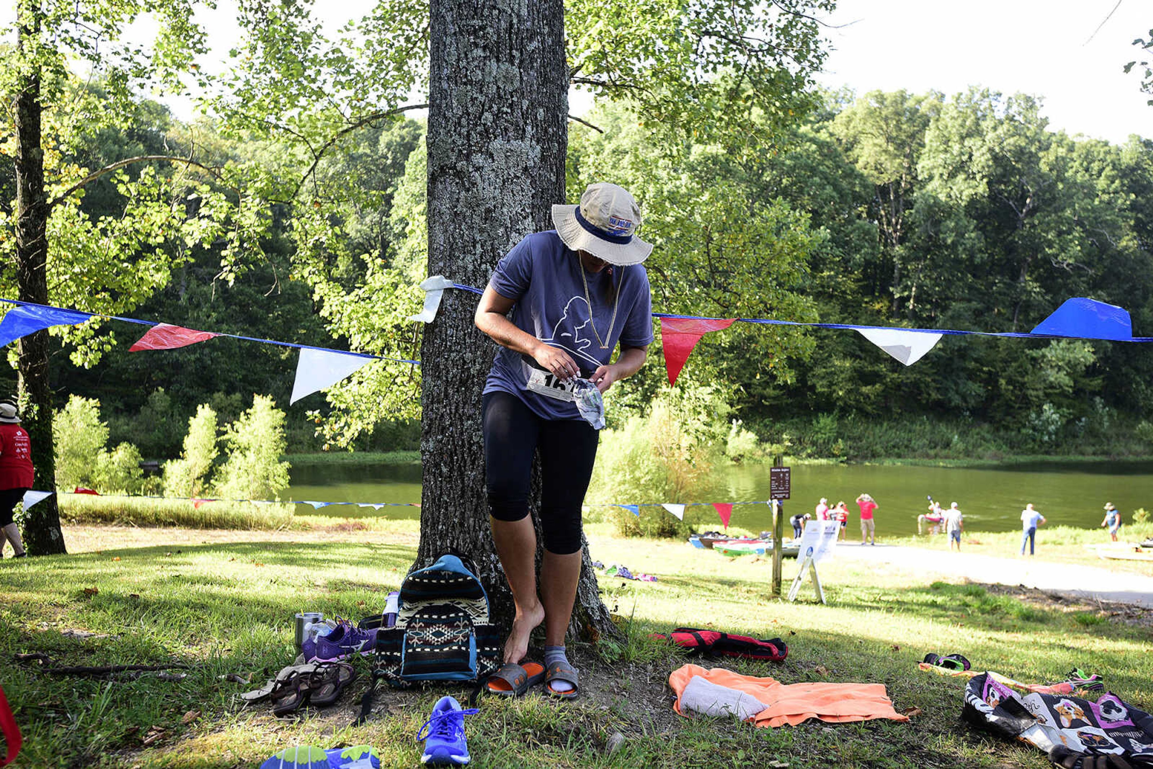 Participants change into running shoes after kayaking on Lake Boutin during the first ever St. Jude Heroes Yak 'n Run on Saturday, Aug. 26, 2017, at Trail of Tears State Park. All proceeds from the event support St. Jude Children's Research Hospital