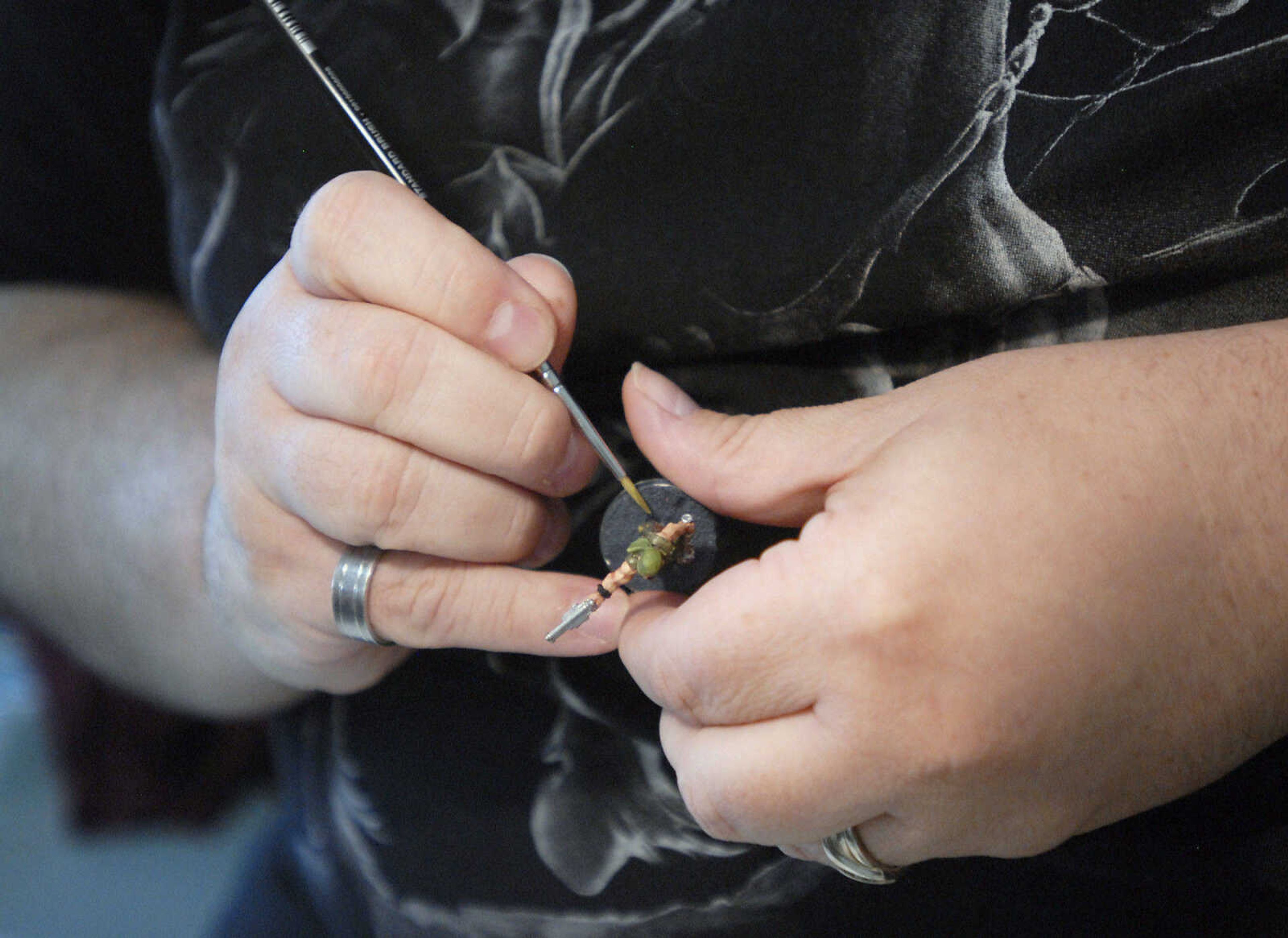 KRISTIN EBERTS ~ keberts@semissourian.com

Larry Snodgrass paints miniature war gaming figurines during the sixth annual Cape Comic Con on Saturday, June 25, 2011, at the Osage Centre in Cape Girardeau.