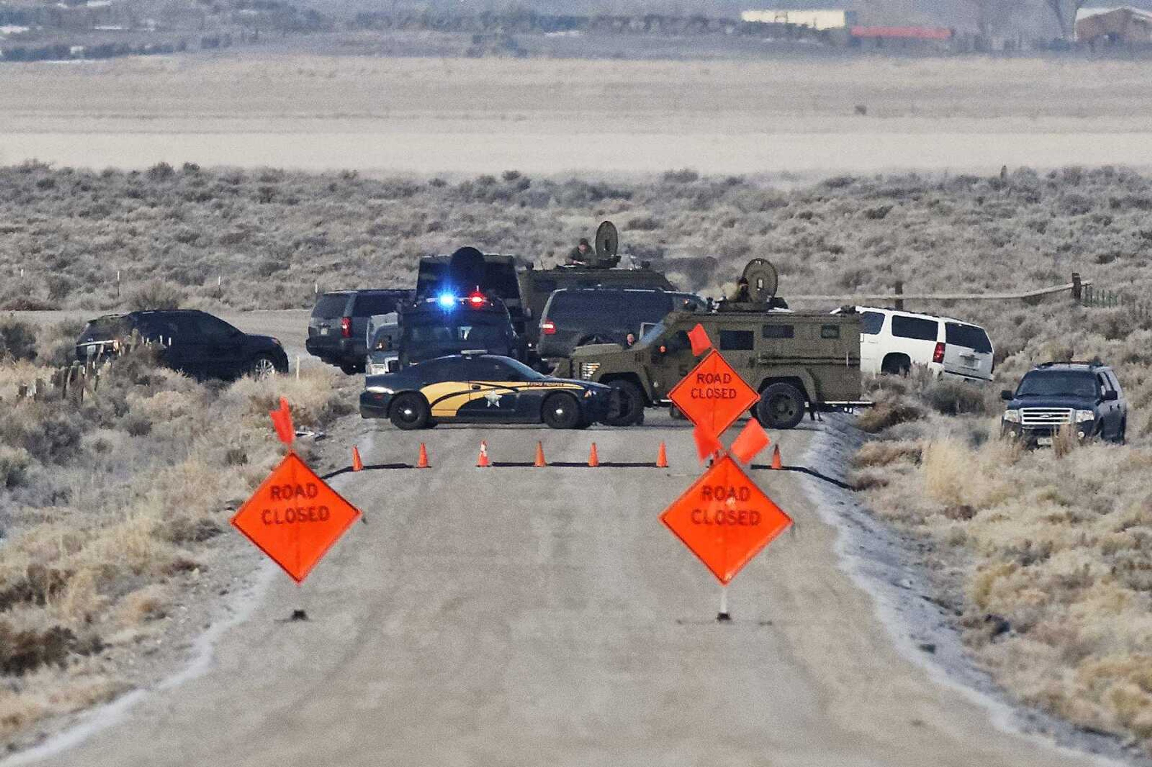 Law-enforcement personnel block an access road Wednesday to the Malheur National Wildlife Refuge near Burns, Oregon.