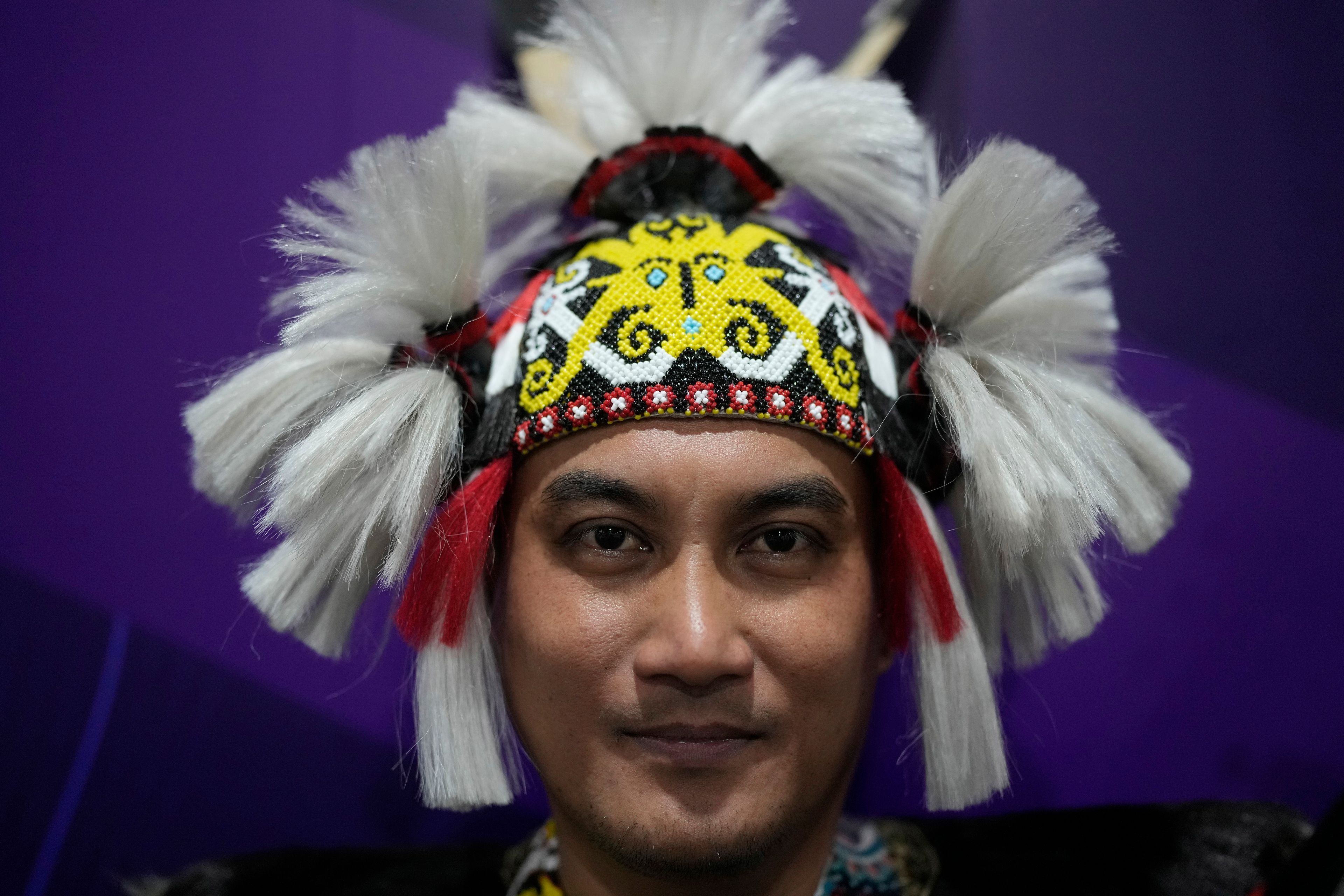 Jackson Michael, 40, of the Borneo, Malaysia, from the Iban community, poses for a photo during at the COP29 U.N. Climate Summit, Tuesday, Nov. 12, 2024. in Baku, Azerbaijan. (AP Photo/Rafiq Maqbool)