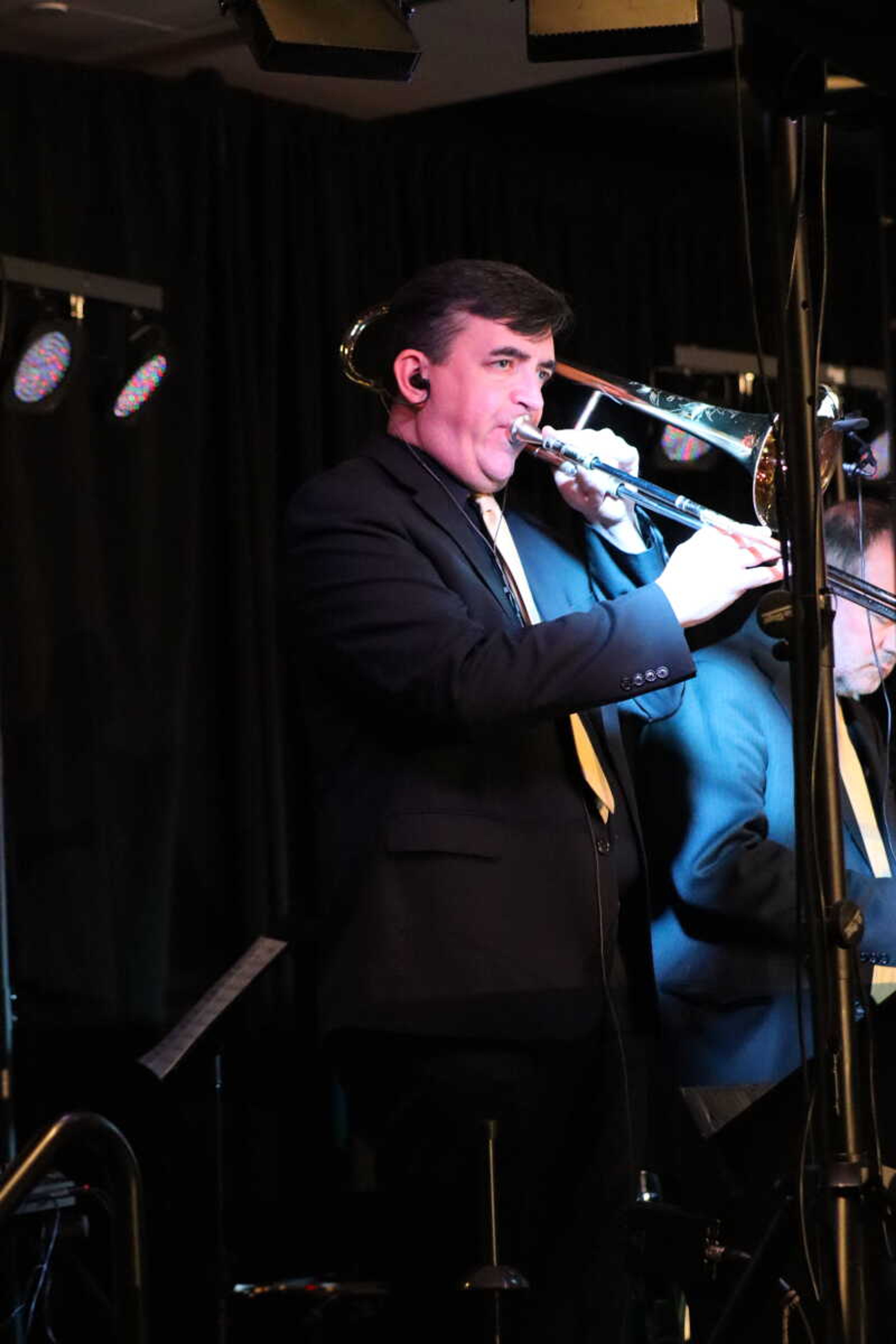 Spectrum's Dave plays his trombone along with the band